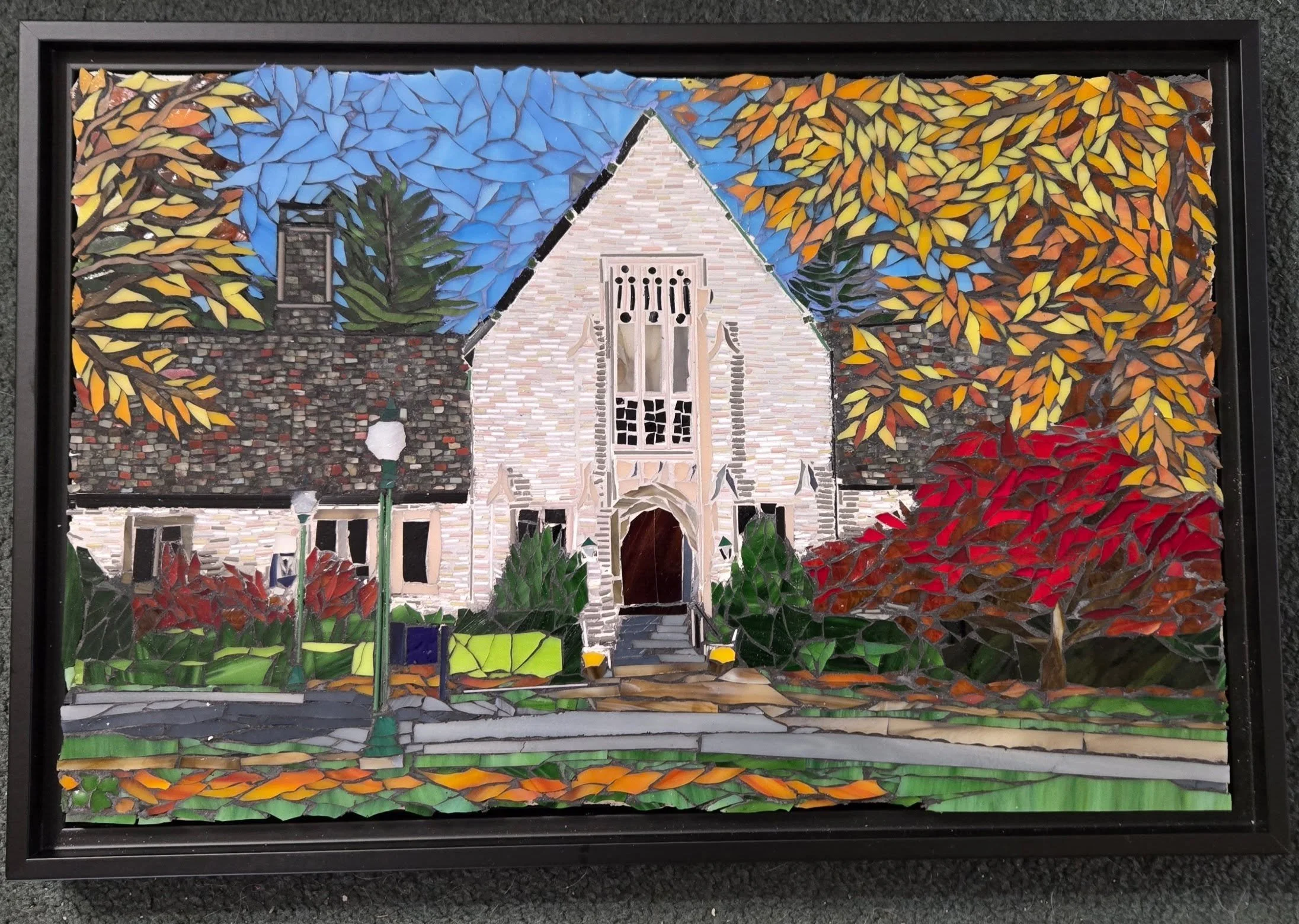 Just wanted to share an image of a glass mosaic i created as a commission.  This mosaic is 11"x17"  glass on MDF board in thinset and grouted.  The pieces of glass in the building are about the size of sprinkles made from glass filati (thin