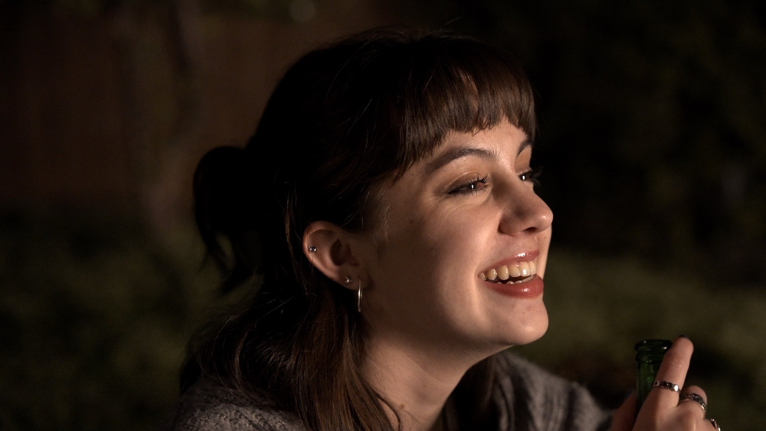 Gabriela Ayala Yarbrough smiling off-camera, on film