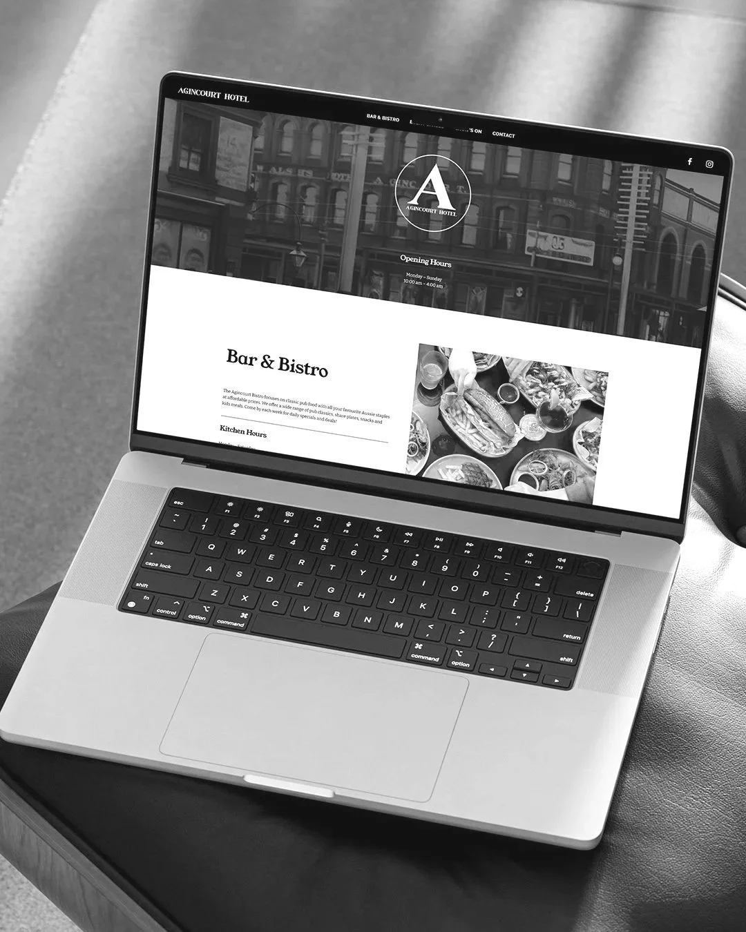 Laptop displaying the website of Agincourt Hotel's Bar & Bistro section. The site shows opening hours and a photo of food on a table.