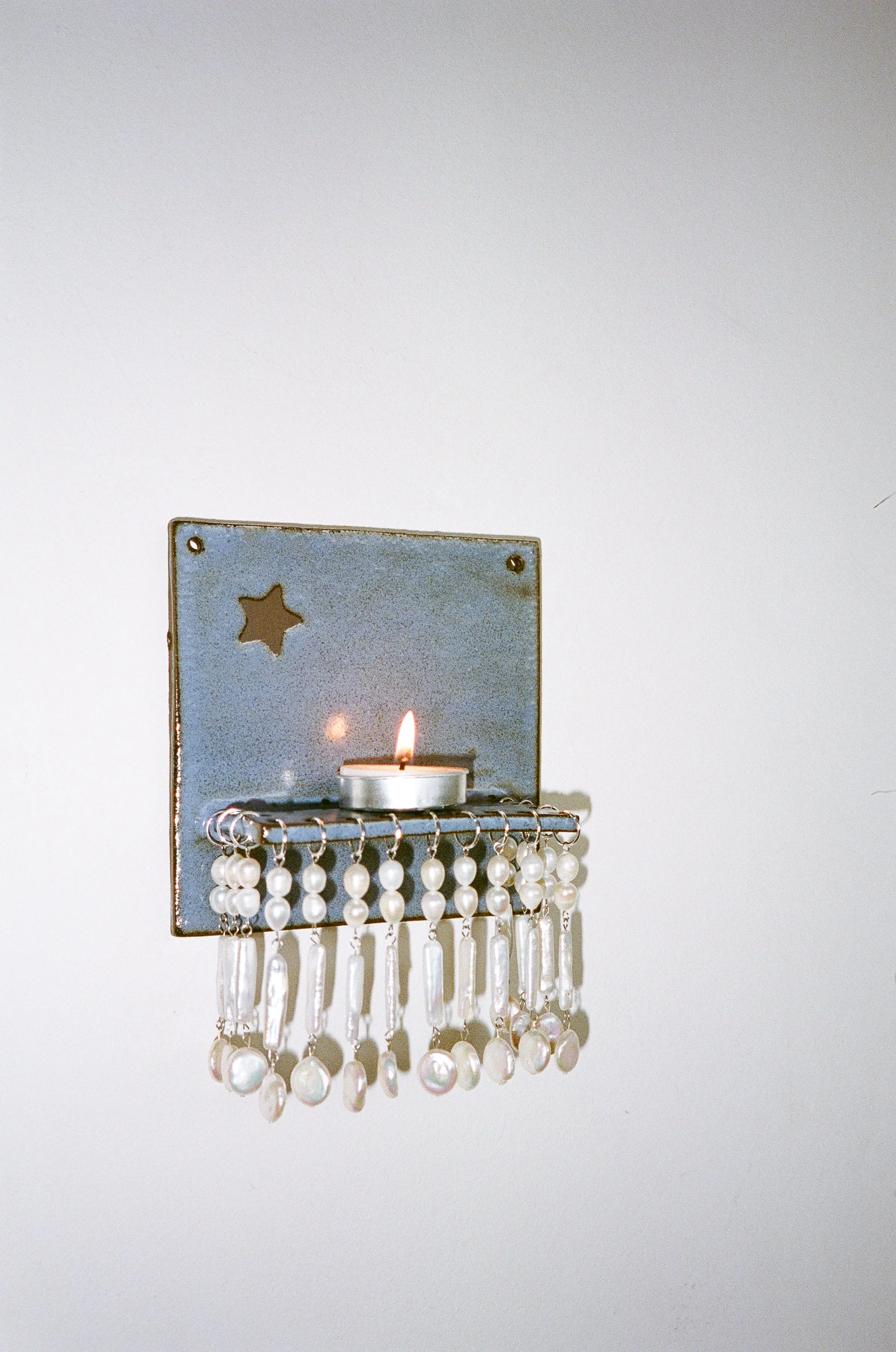 BABY PLUTO CANDLE SCONCE