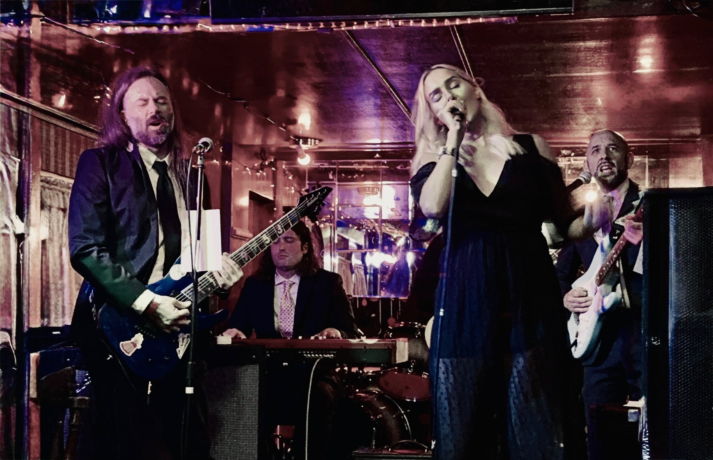 Cakewalk band performing on a bright colorful stage