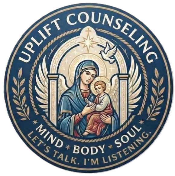 A circular logo for Uplift Counseling featuring an illustration of Mary holding baby Jesus, with a dove and a star above, surrounded by text that reads 'Uplift Counseling: Mind, Body, Soul. Let's Talk. I'm Listening.' in a gold and blue color scheme.
