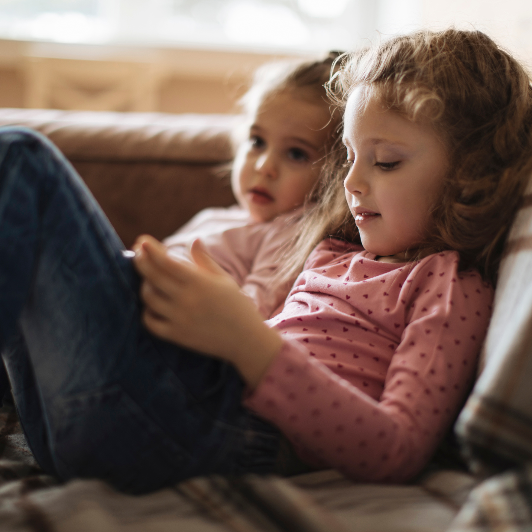 Children relaxing comfortably in air-conditioned living room