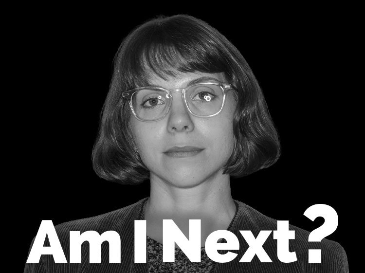 A woman with short hair and glasses looking directly at the camera, with the text "Am I Next?" at the bottom.