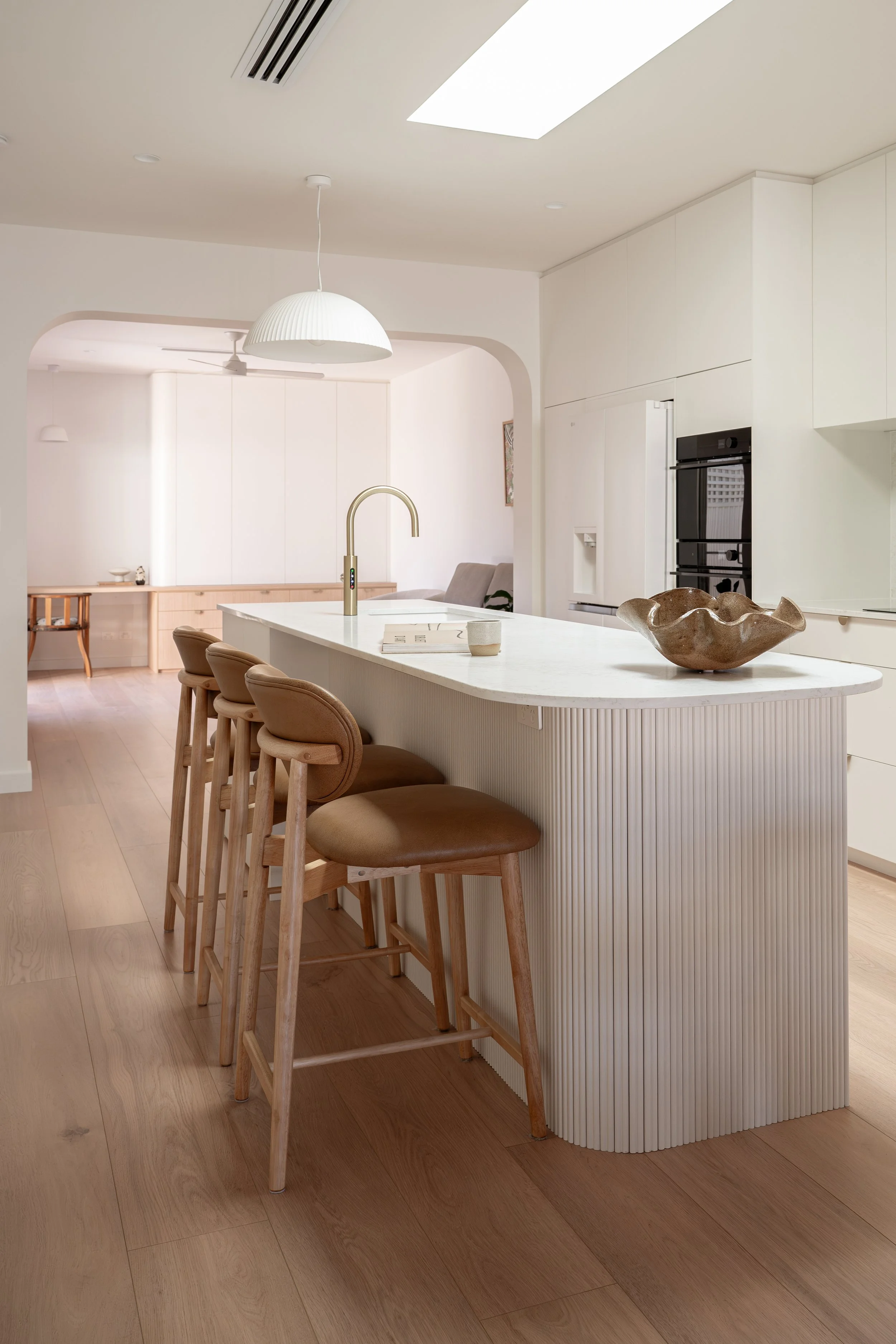 Neutral kitchen, featuring timber and feature island battoning. 