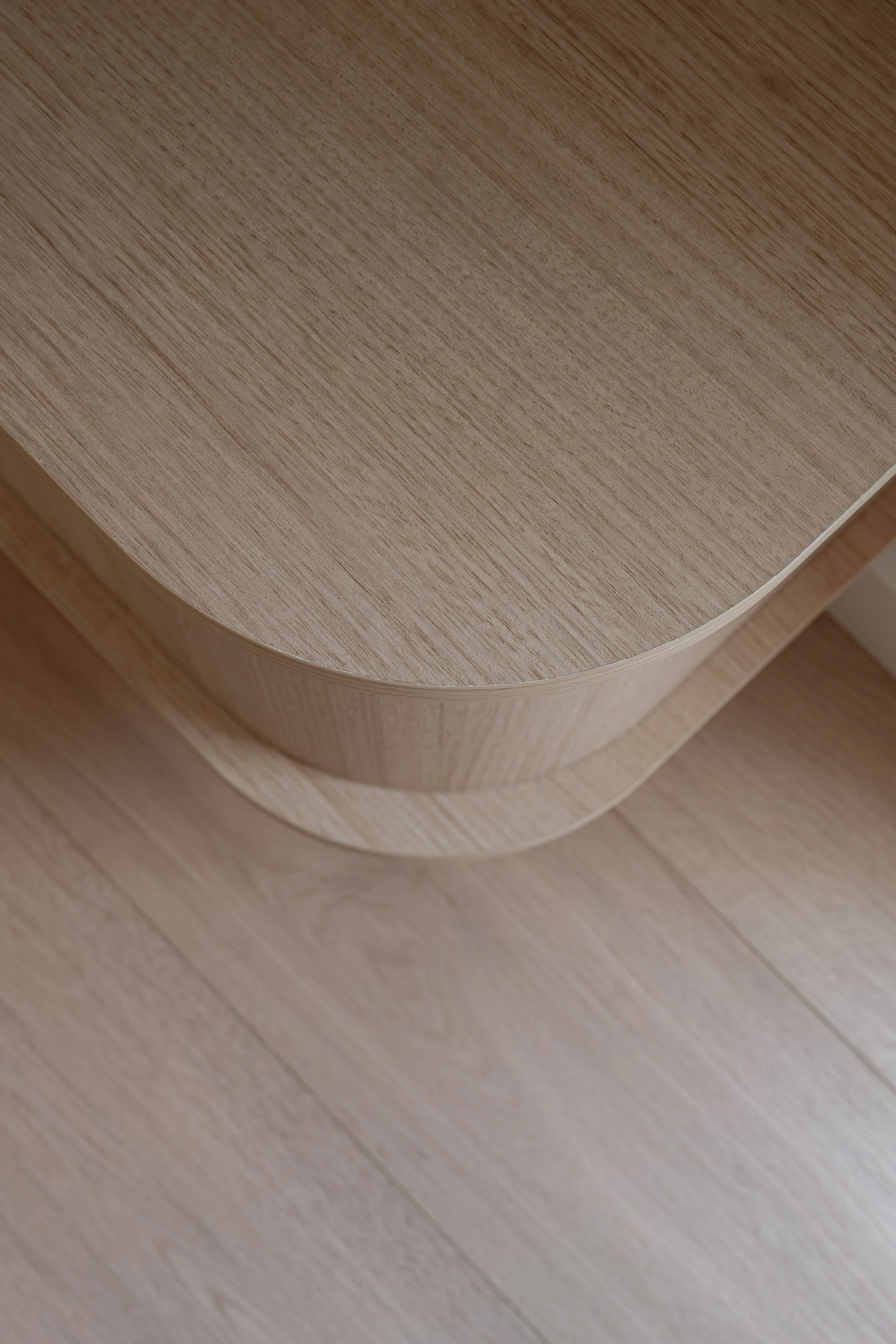 Curved timbergrain cabinet end. 