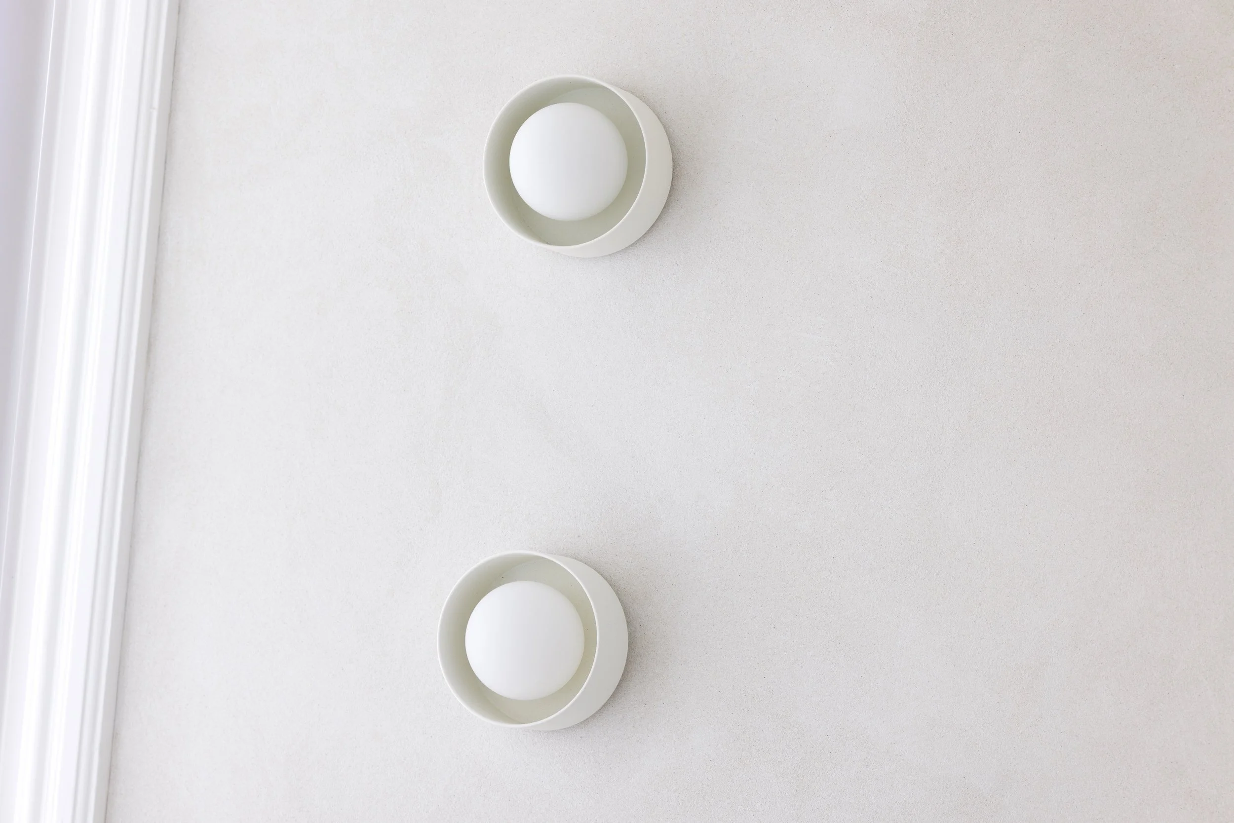 White wall lights and texture wall finish