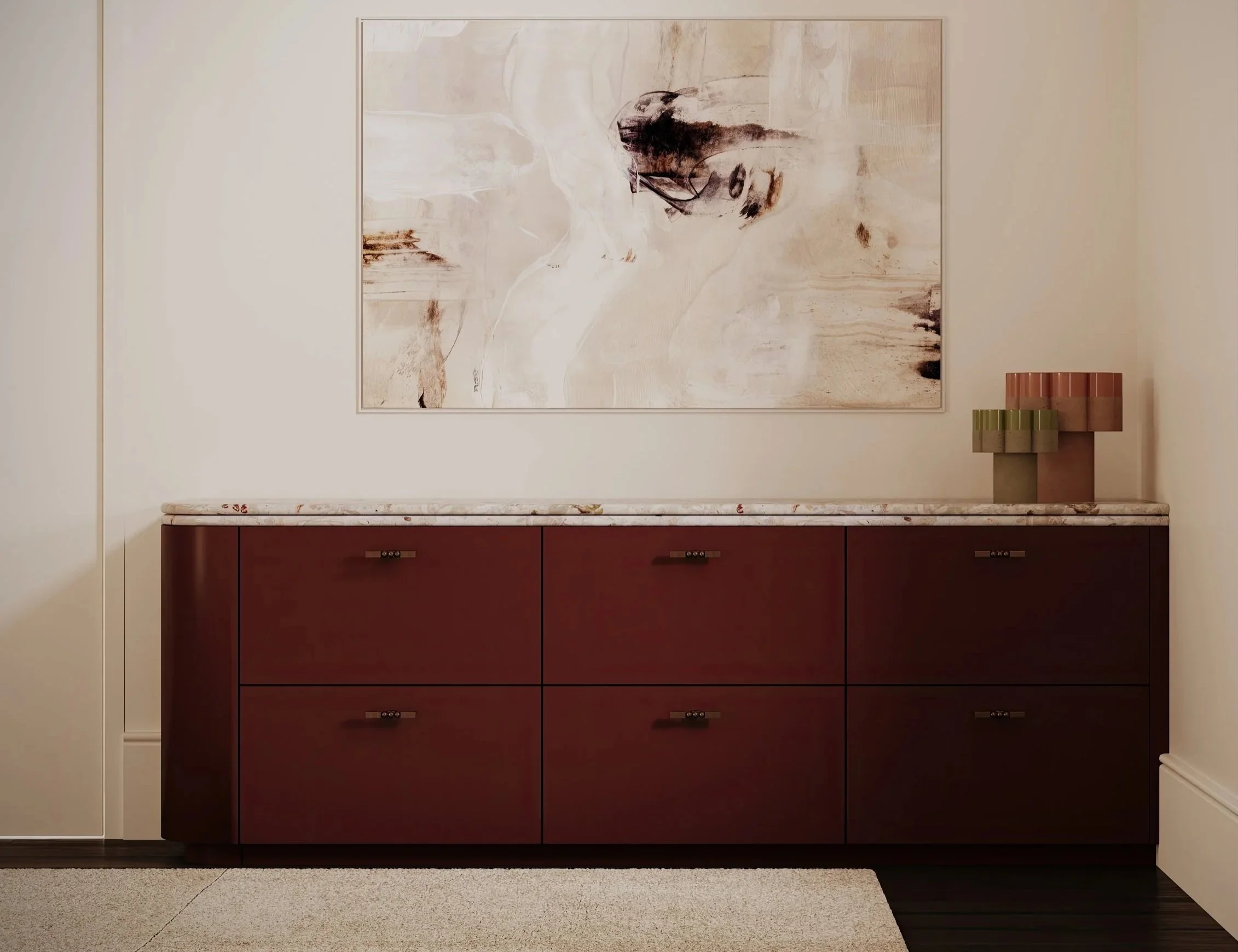A modern sideboard designed by Bethany Jane Interior Design in Laminex Kalamata with a marble top in soft pink and green tones with bronze feature handles.