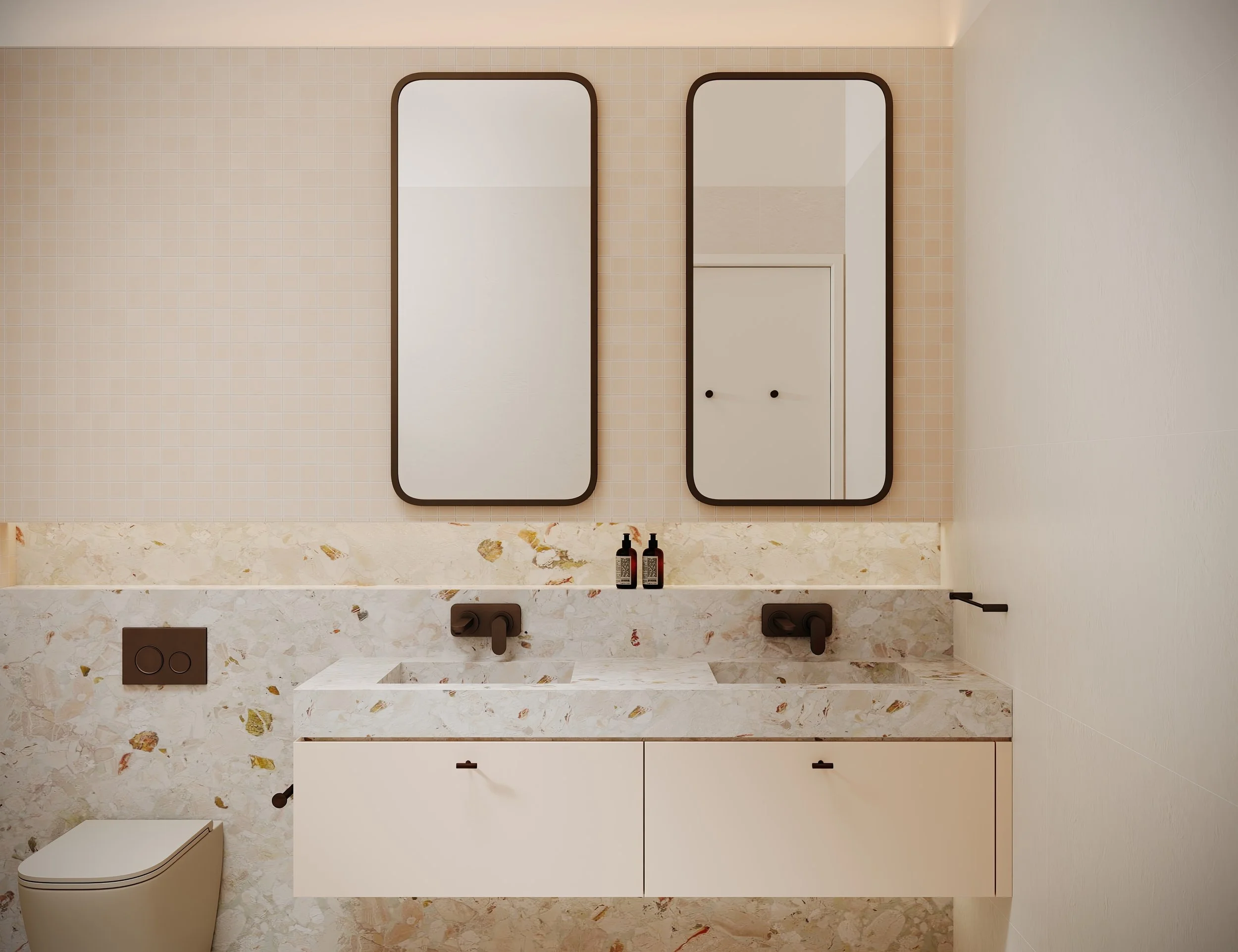 Soft pink bathroom with marble top in soft pink, green, and gold. 
