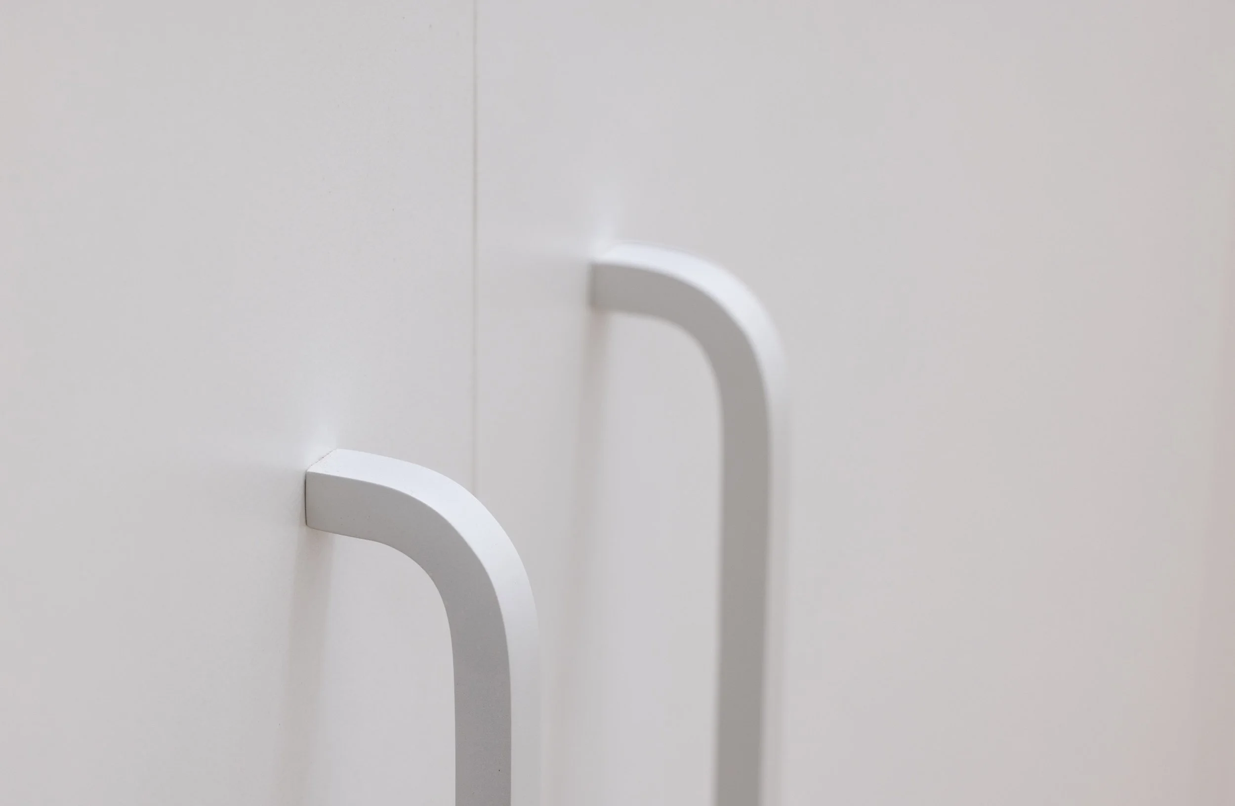 Curved white handles
