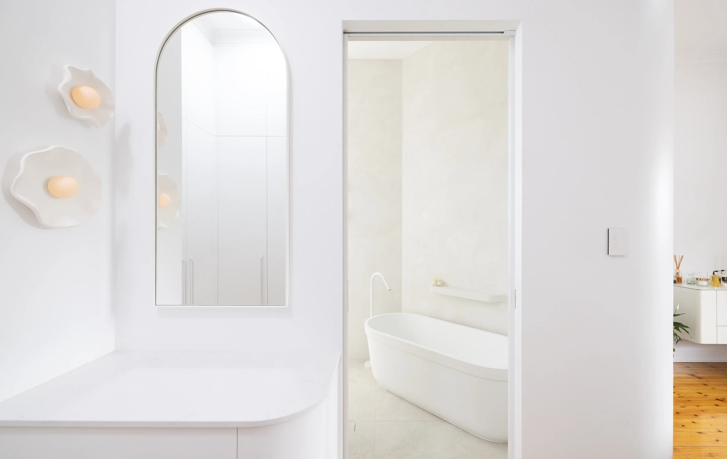 White bathroom with texture wall finish