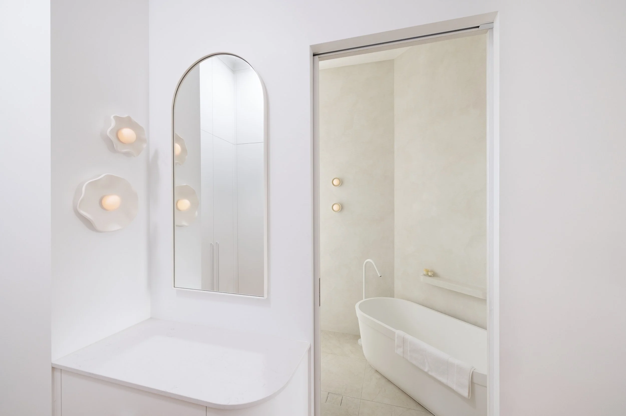 White bathroom with texture wall finish 