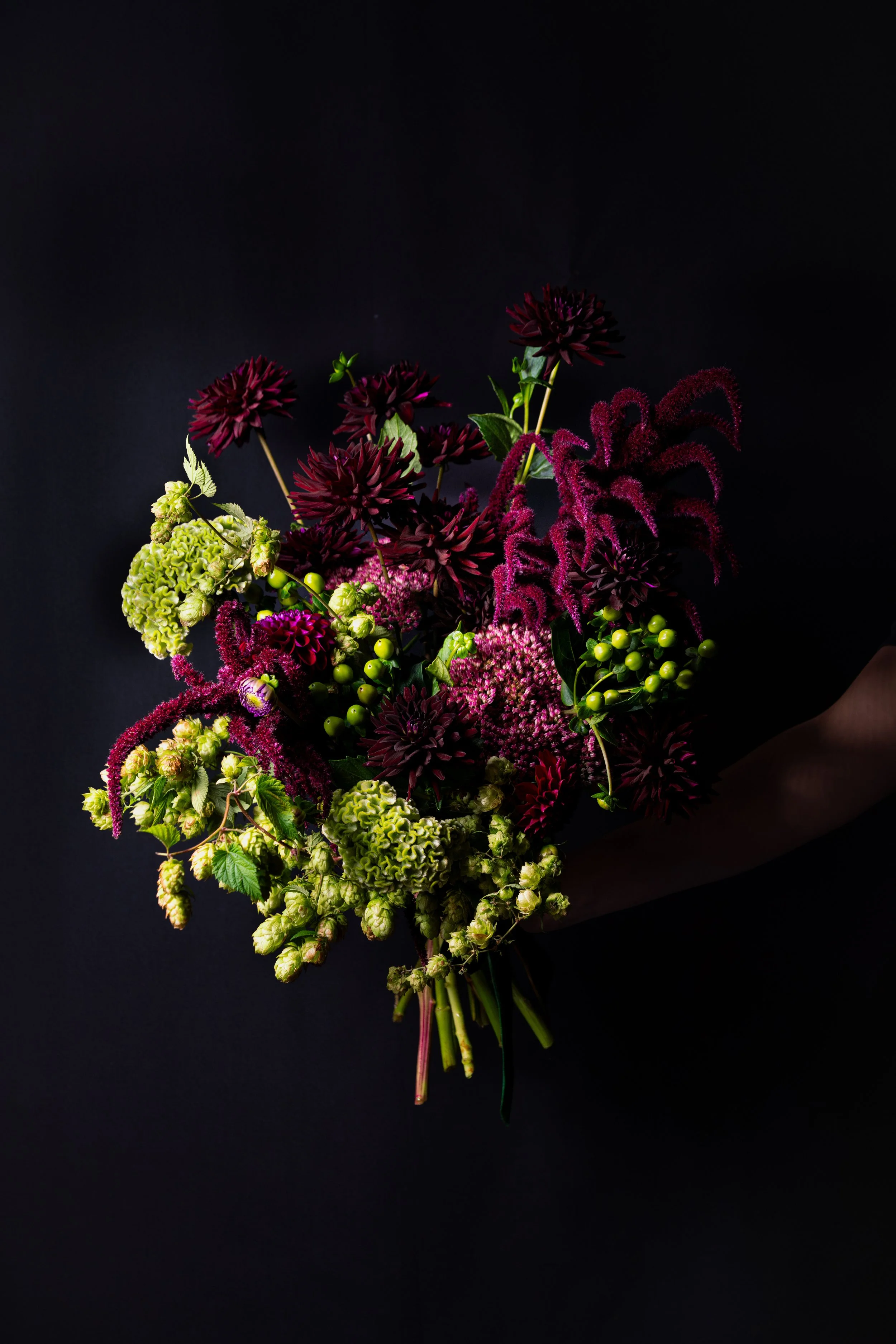 Sculptural seasonal bouquet in burgundy, berry and green tones, hand-tied by fōrm&blōm in Oakham, Rutland