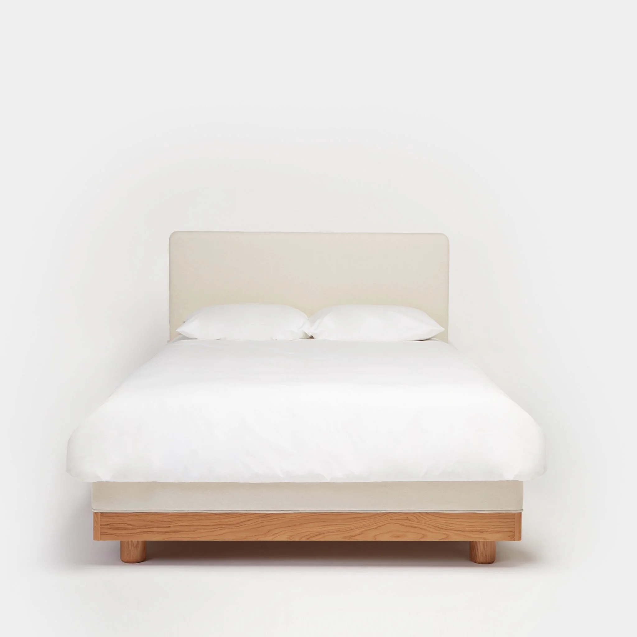 Another Bed by Another Country with oak and upholstered headboard