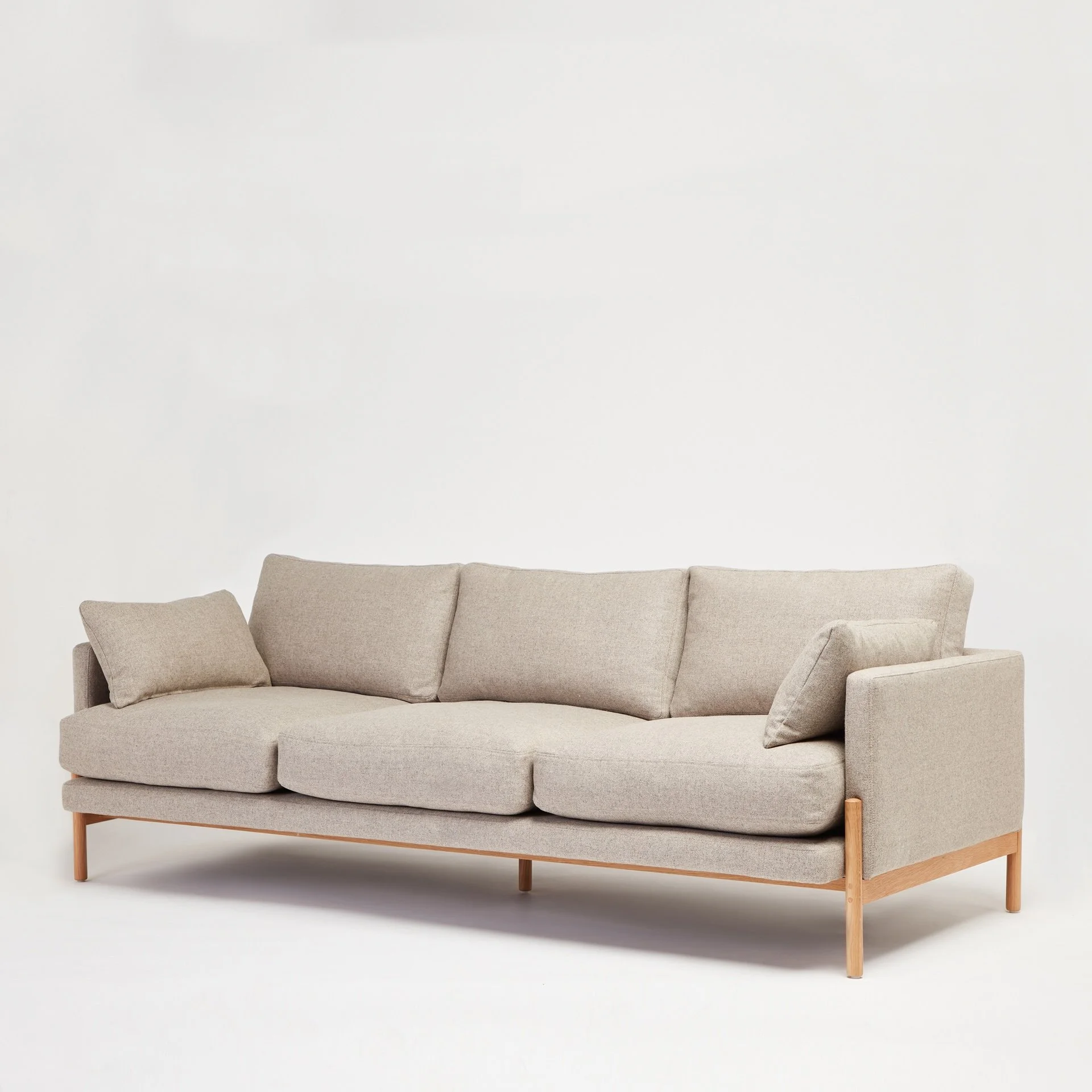 Another Sofa showing deep upholstered cushions and natural oak frame