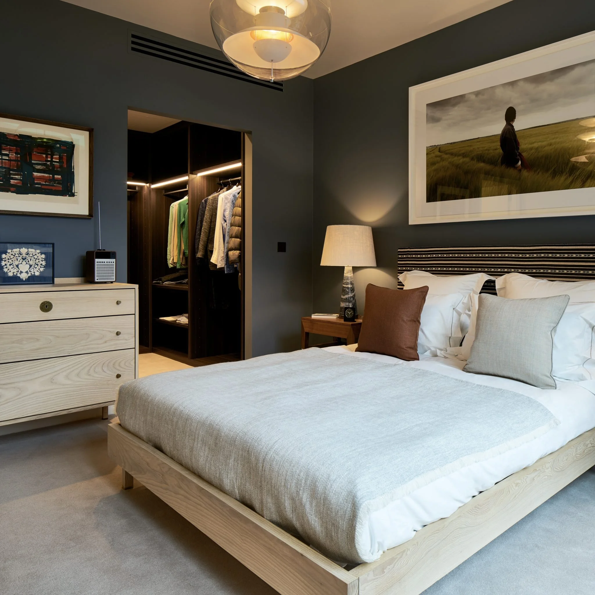 Another Country Chest of Drawers TWO in a dark painted contemporary bedroom
