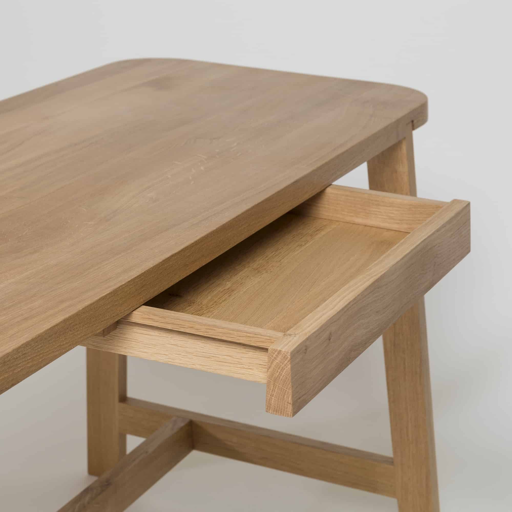 Desk THREE showing central drawer, rounded timber top and trestle-style base (Copy)