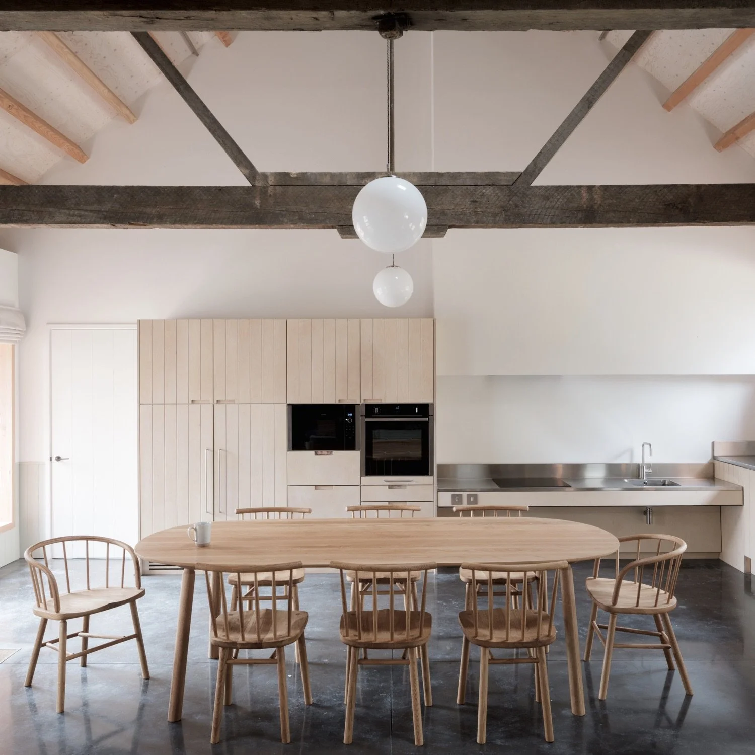 David Irwin Hardy Chair by Another Country in a contemporary kitchen dining interior