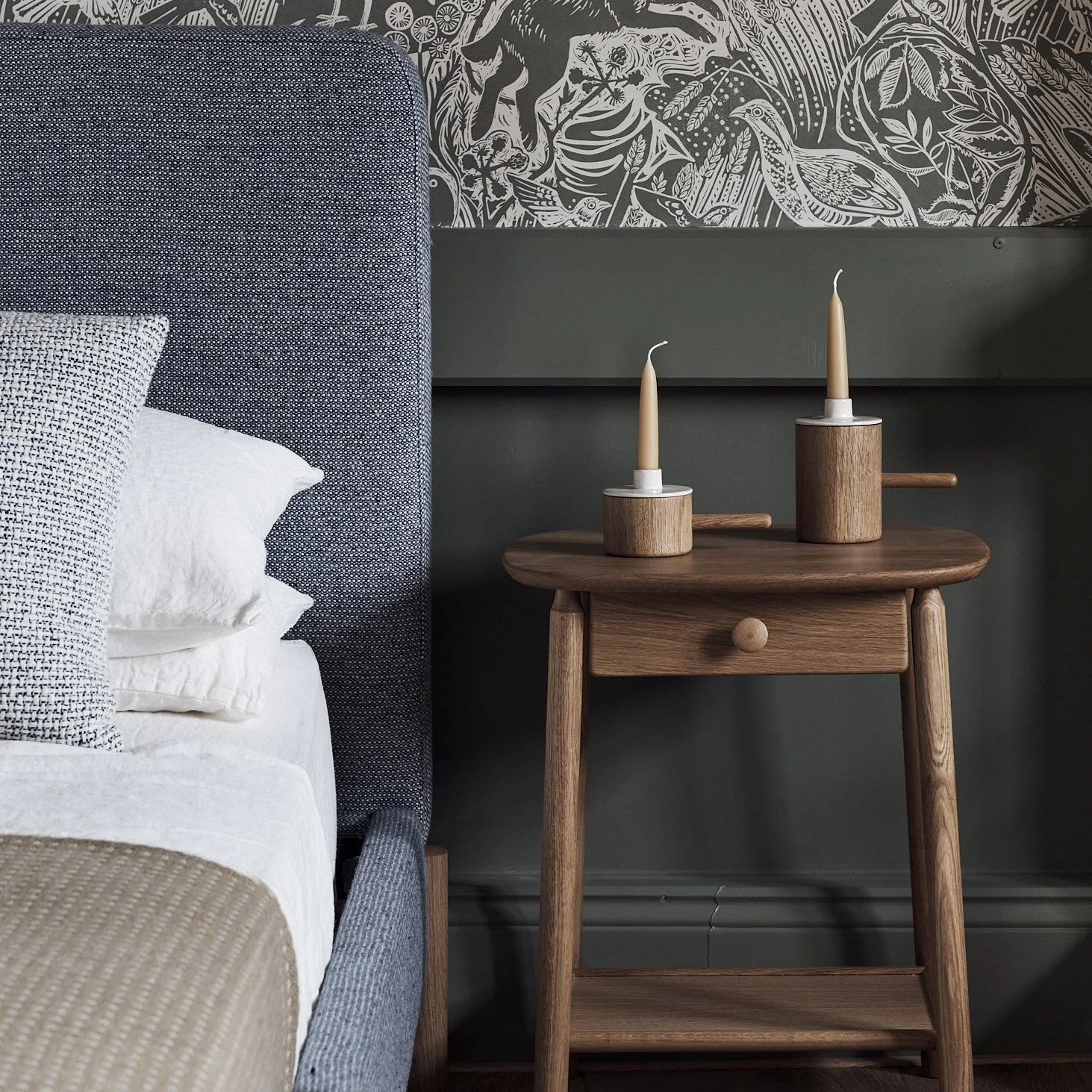 Wick Bed showing upholstered frame and distinctive solid oak leg detail