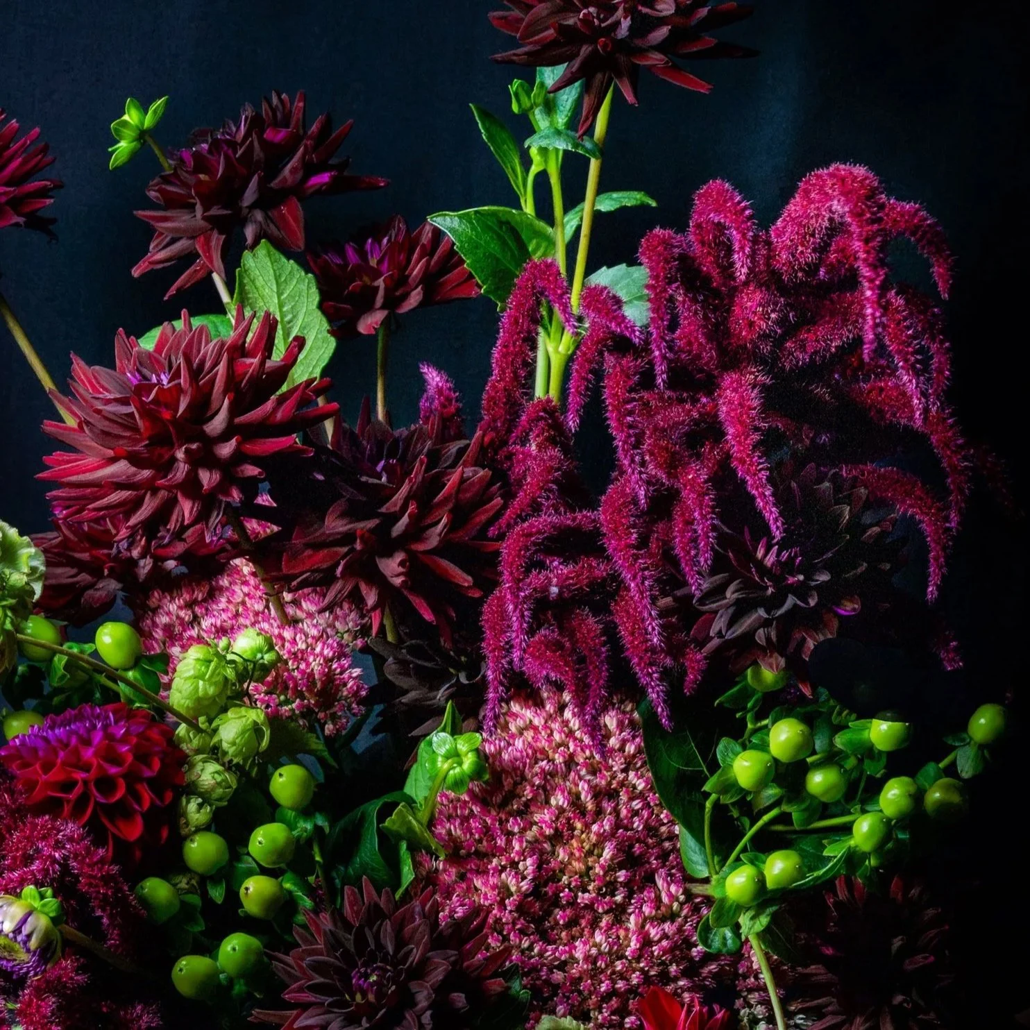 Deep burgundy and magenta seasonal flowers and textural stems in The Dramatic One bouquet
