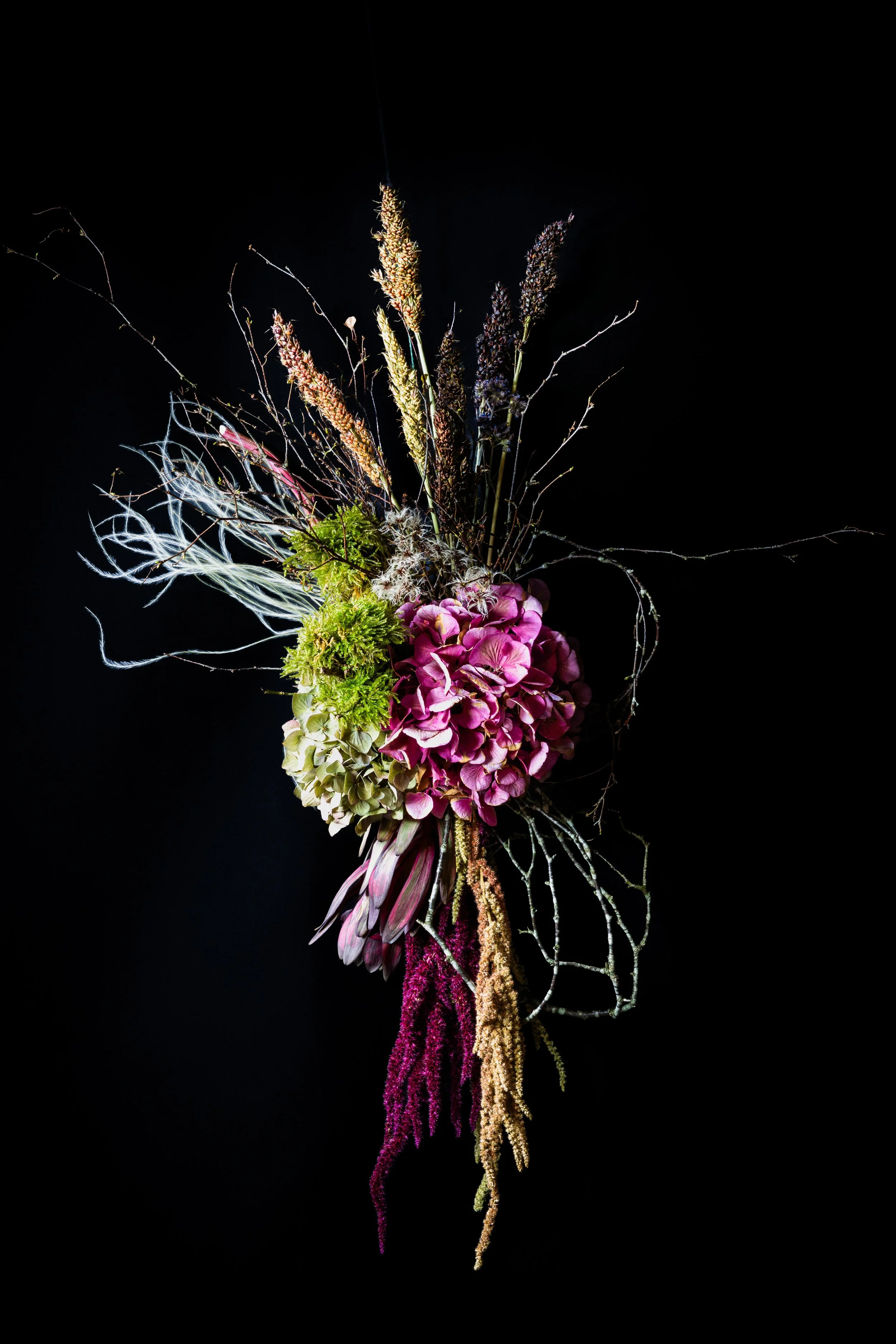 The Sculptural One – hanging seasonal botanical swag of hydrangea, branches, grasses and textural natural materials by fōrm&blōm