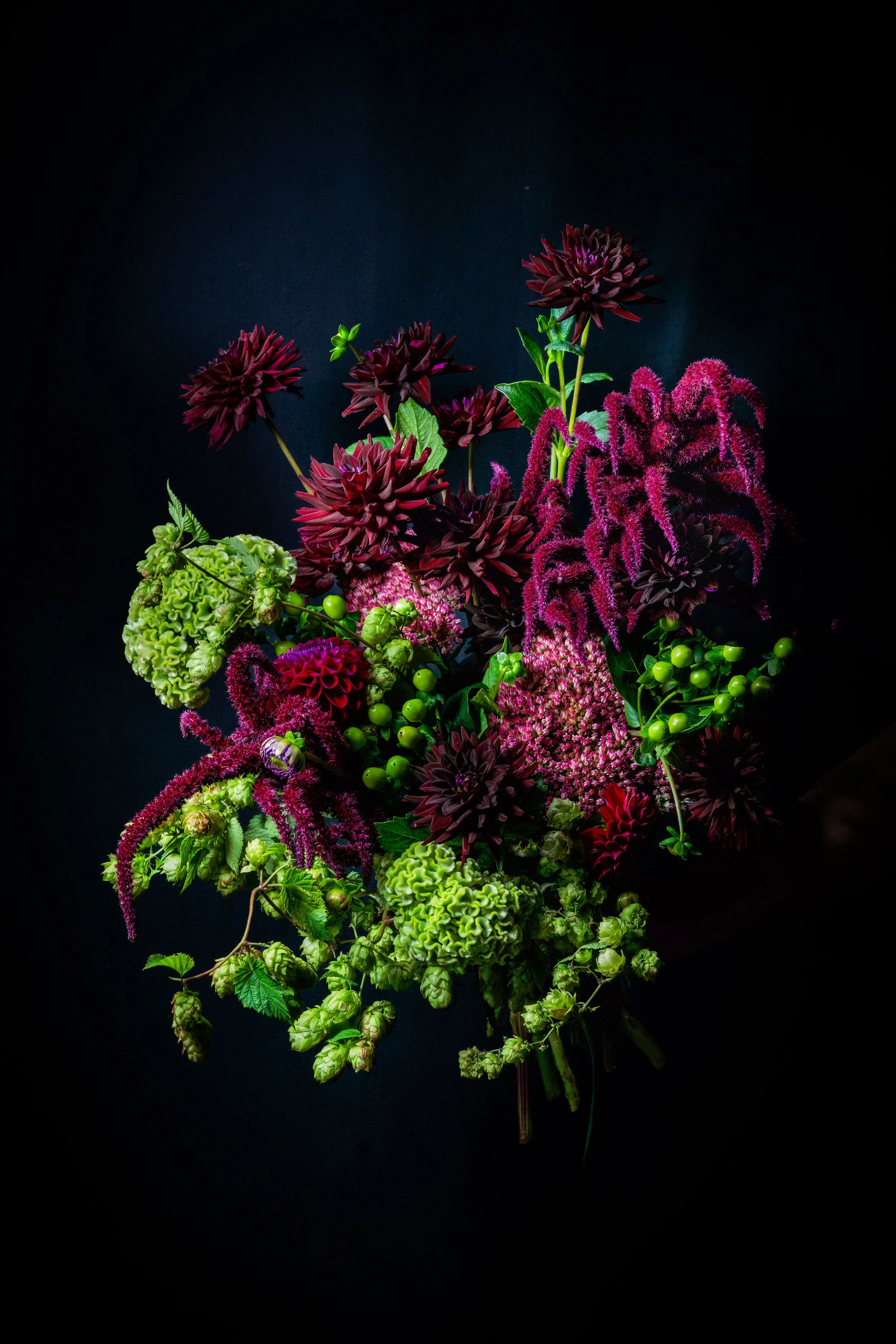 The Dramatic One hand-tied bouquet by fōrm&blōm, with deep burgundy, plum and fresh green seasonal flowers