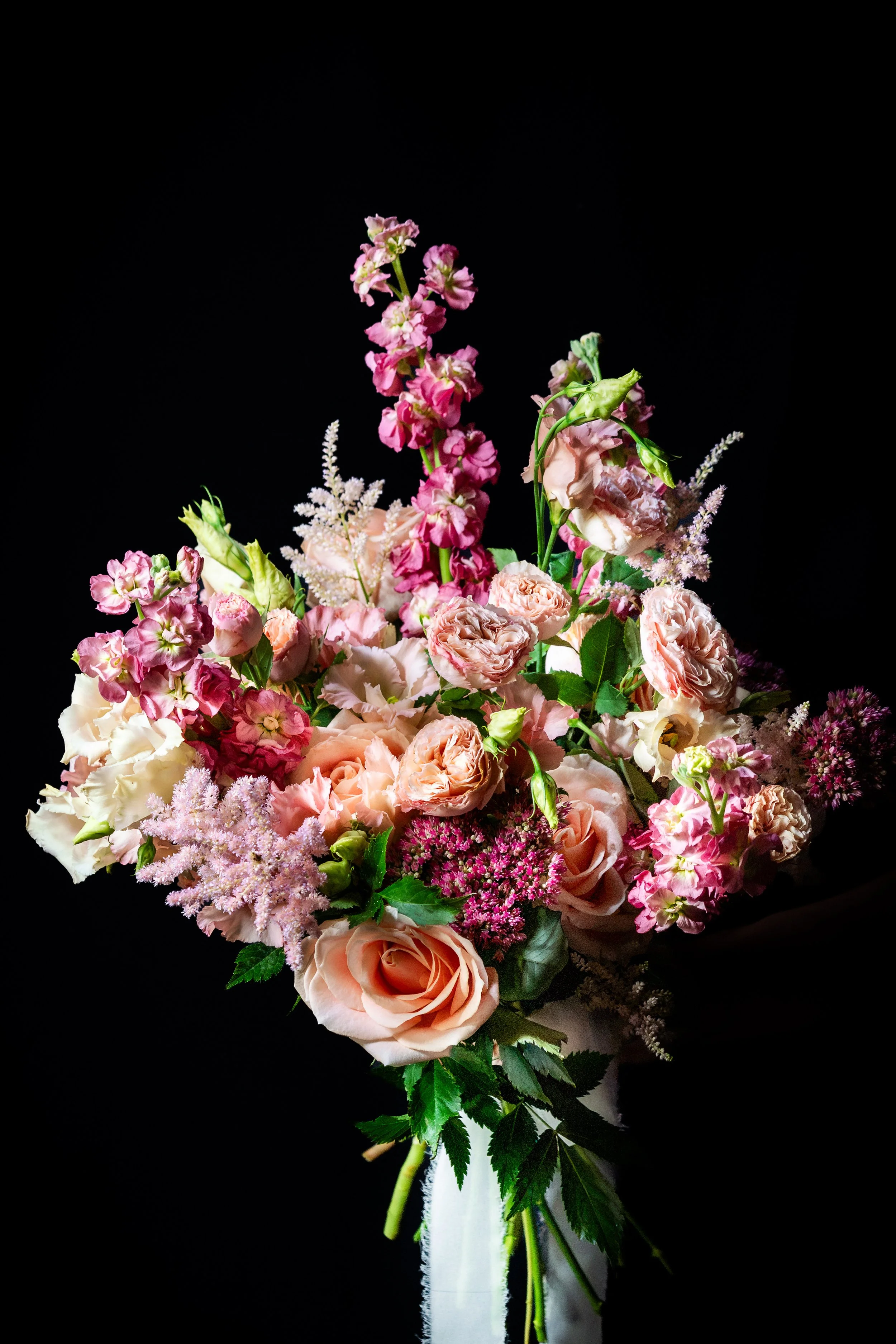 The Soft One with layered blush flowers, delicate textural stems and fresh green foliage