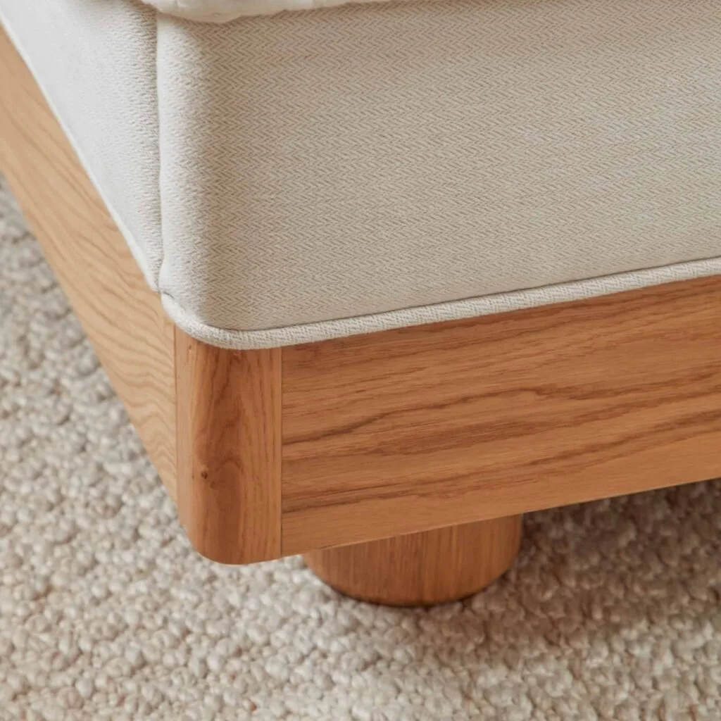 Another Bed showing solid oak legs and piped upholstery detail