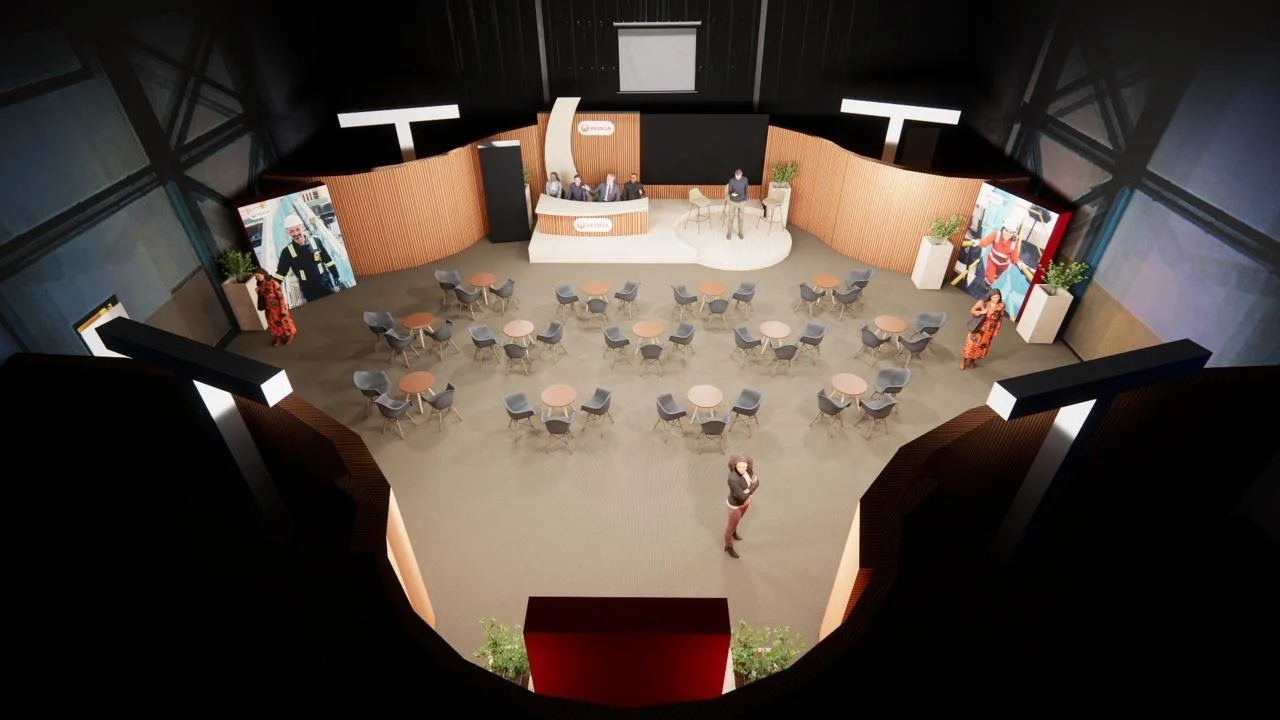 An overhead visualisation of the complete event environment, showing the stage, audience seating, branded displays and spatial layout developed for approximately 100 attendees.