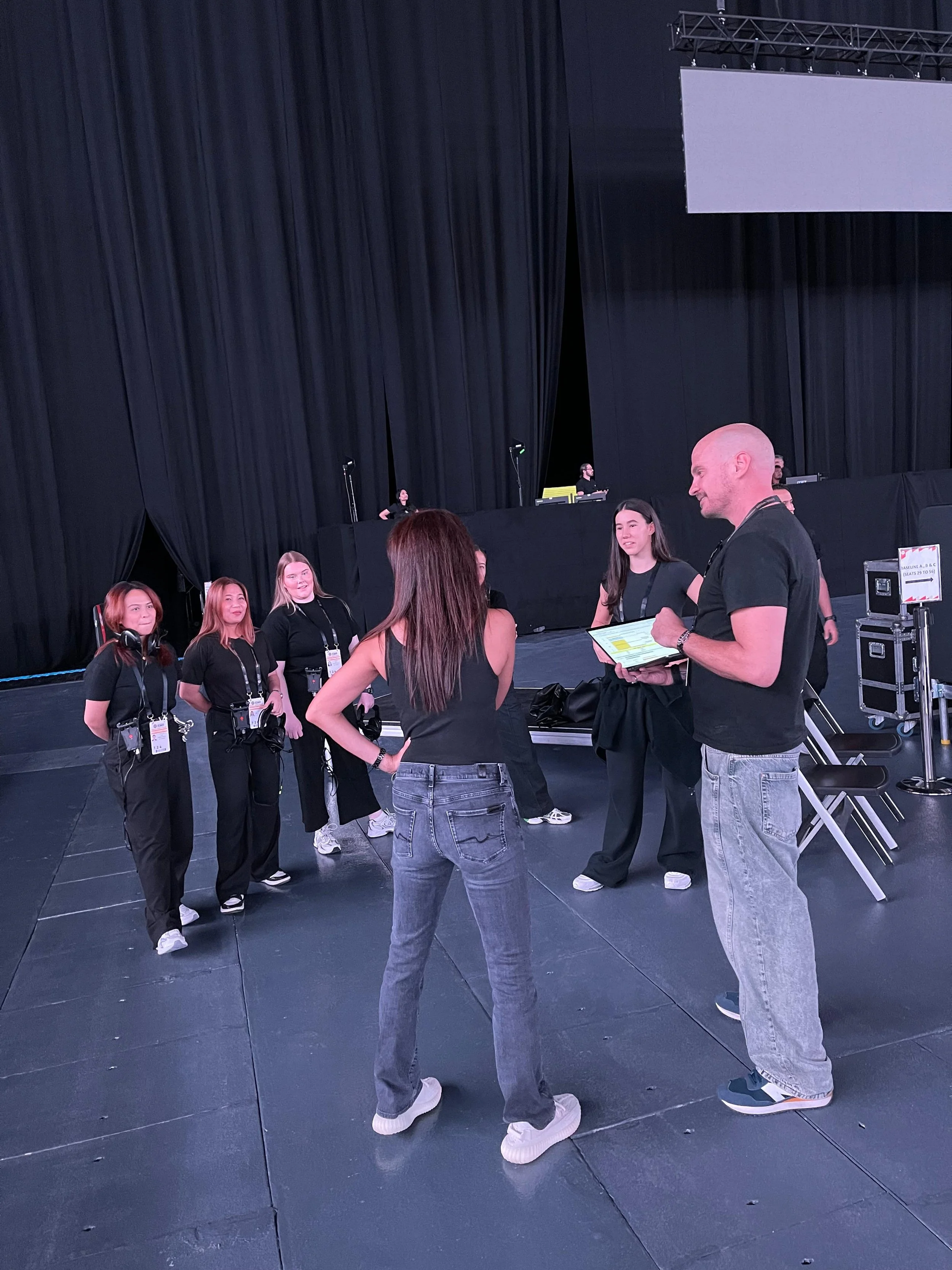 Dan Clark briefing members of the event production team before a Dubai Basketball home game at Coca-Cola Arena.