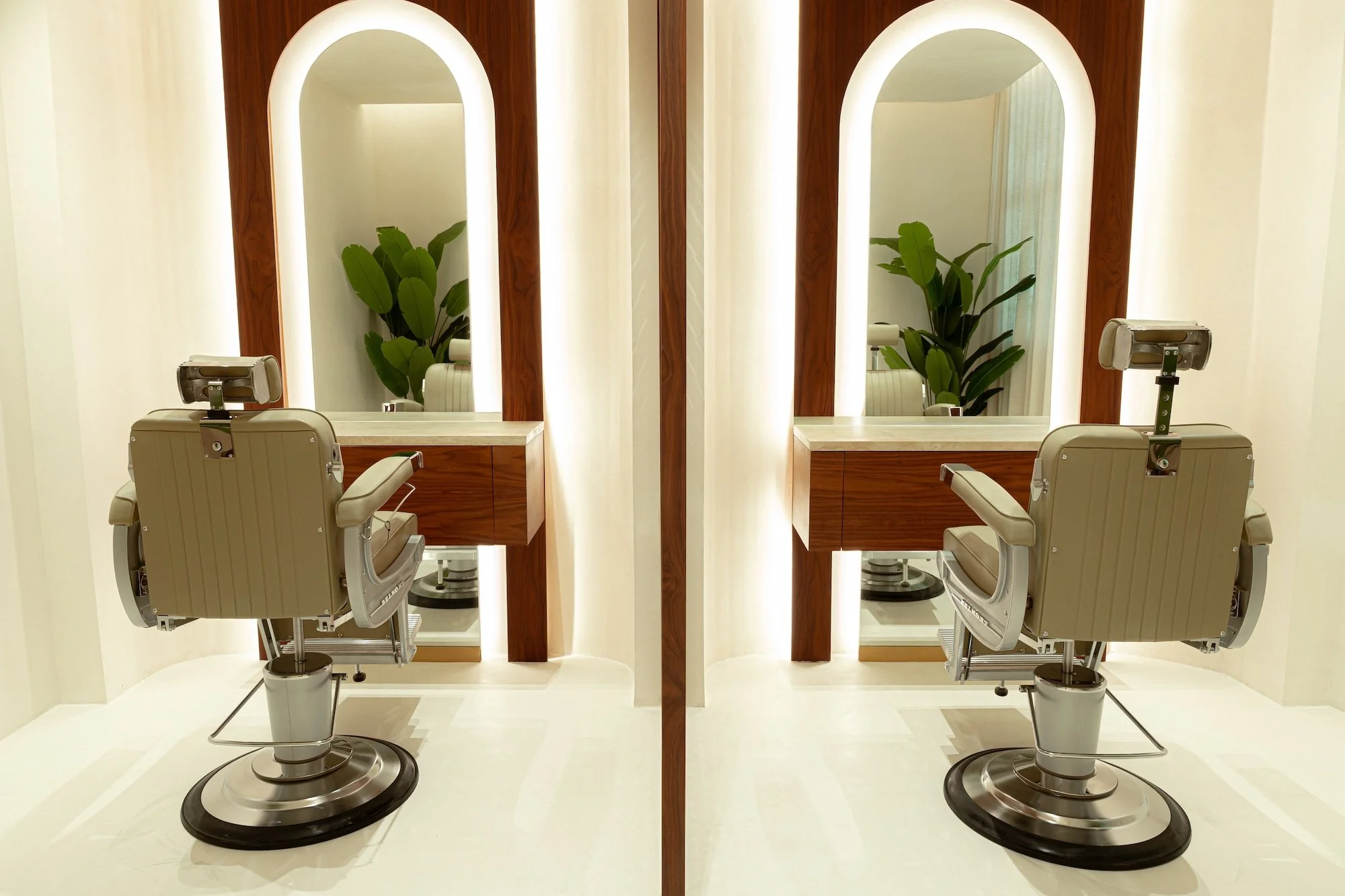 Hair styling stations with illuminated mirrors inside Vera Wellness in Jumeirah, Dubai.