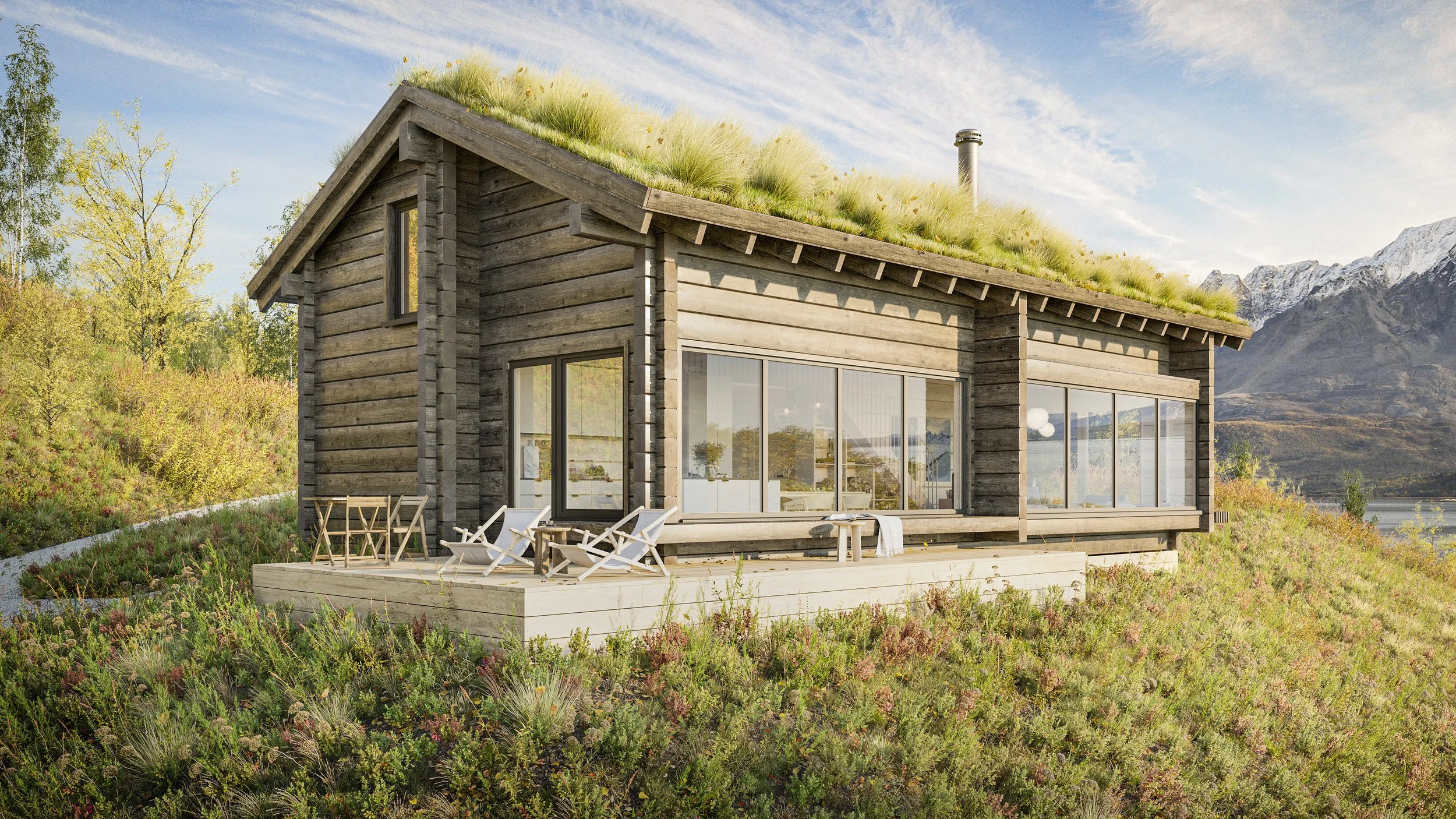 A modern wooden house with large glass windows situated on a grassy hillside with mountain views in the background. The house features a green roof with plants and outdoor seating on a wooden deck.