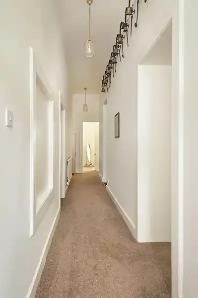 woll-estate-retreats-garden-flat-hallway-bells.webp