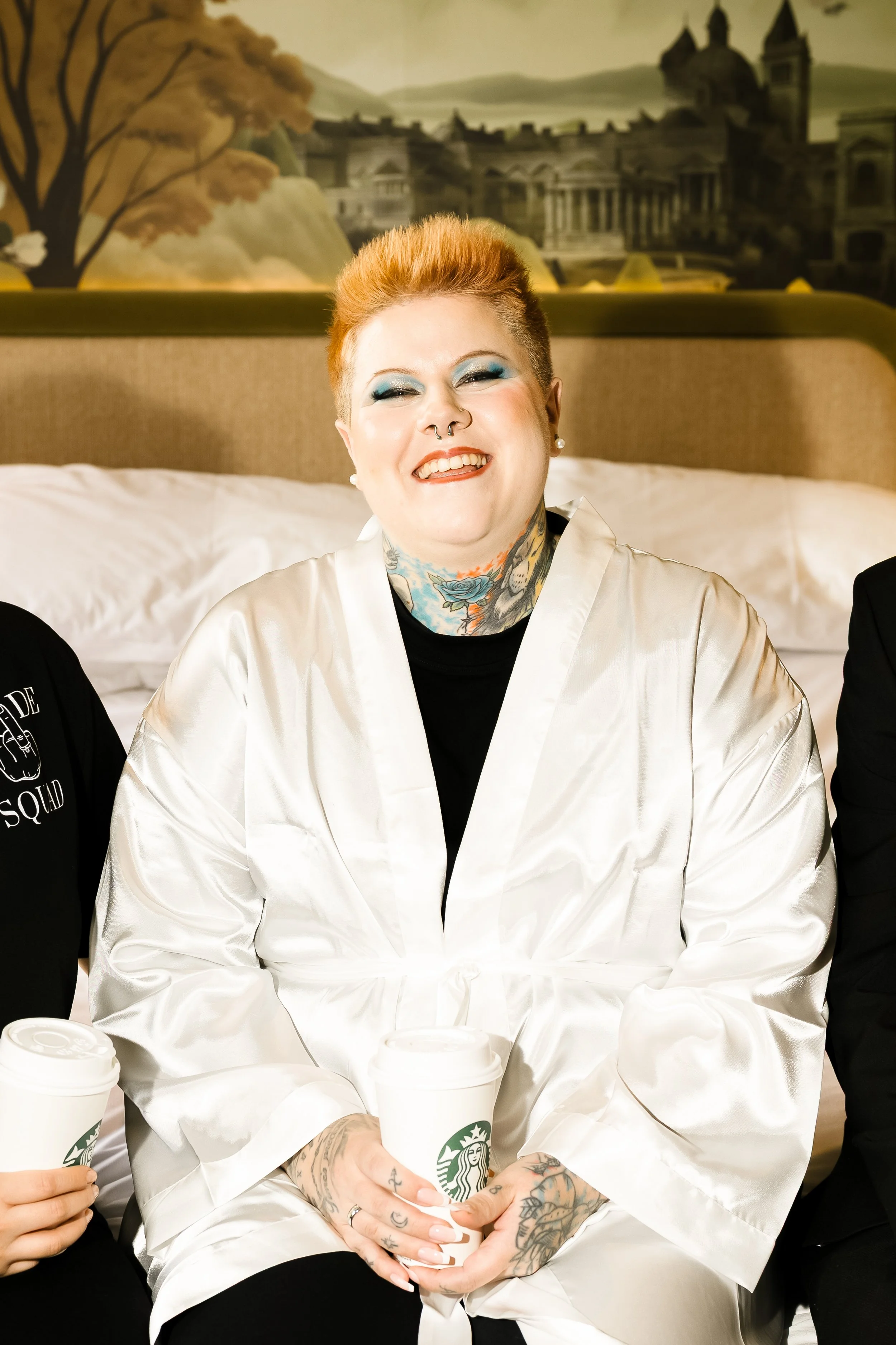 Person in white wedding robe laughing — LGBTQ+ inclusive wedding makeup by Sira Rose Sheffield