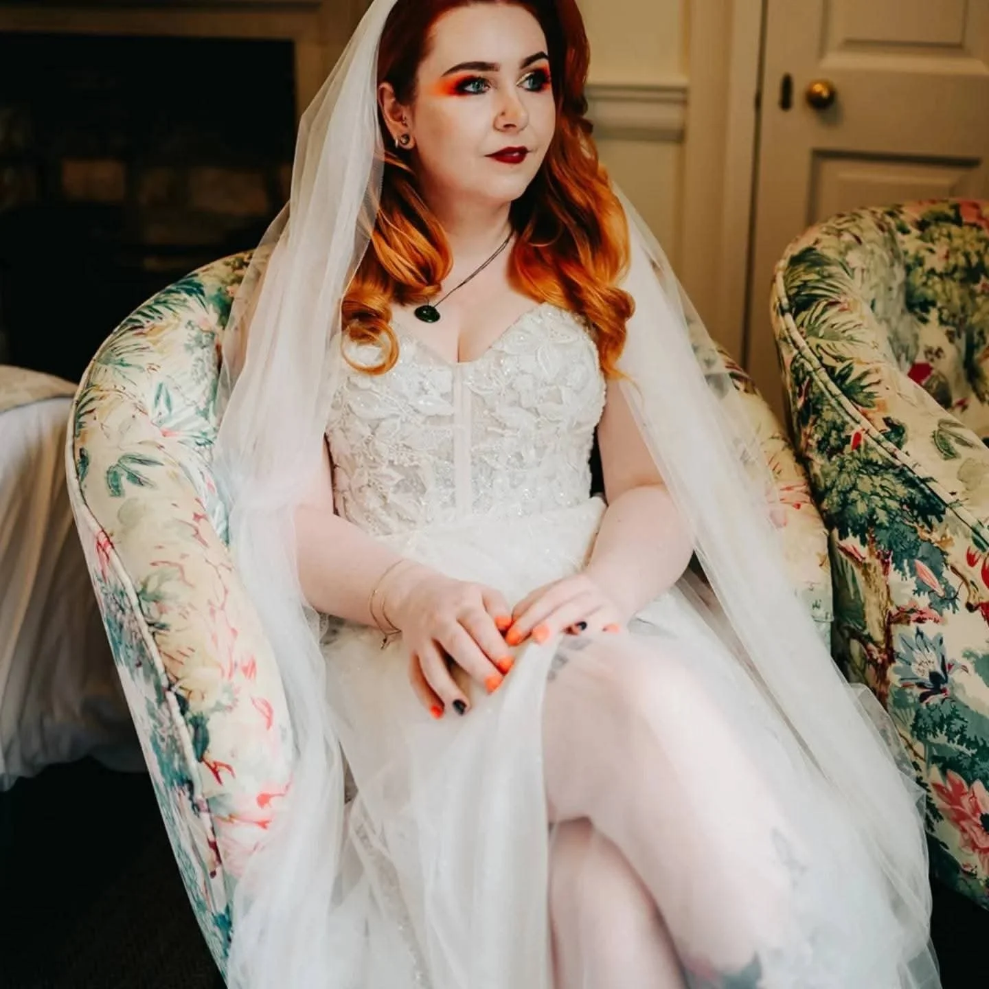 Tattooed bride in white lace dress and veil — alternative wedding makeup by Sira Rose UK