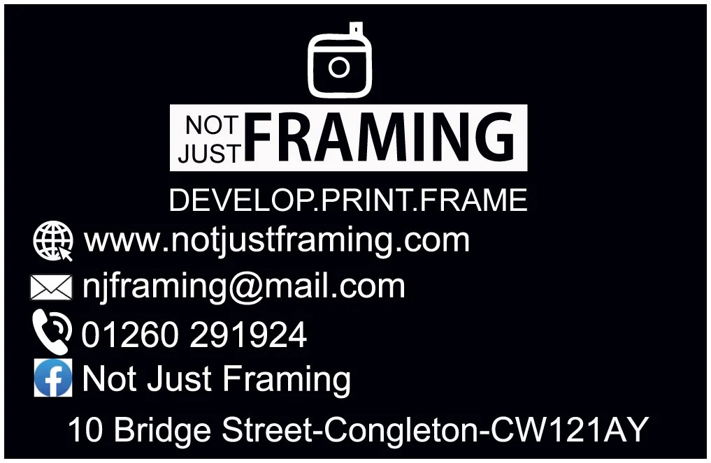 Business card for Not Just Framing with contact info, website, email, phone number, Facebook page, and address, featuring a small logo of a framing corner at the top.