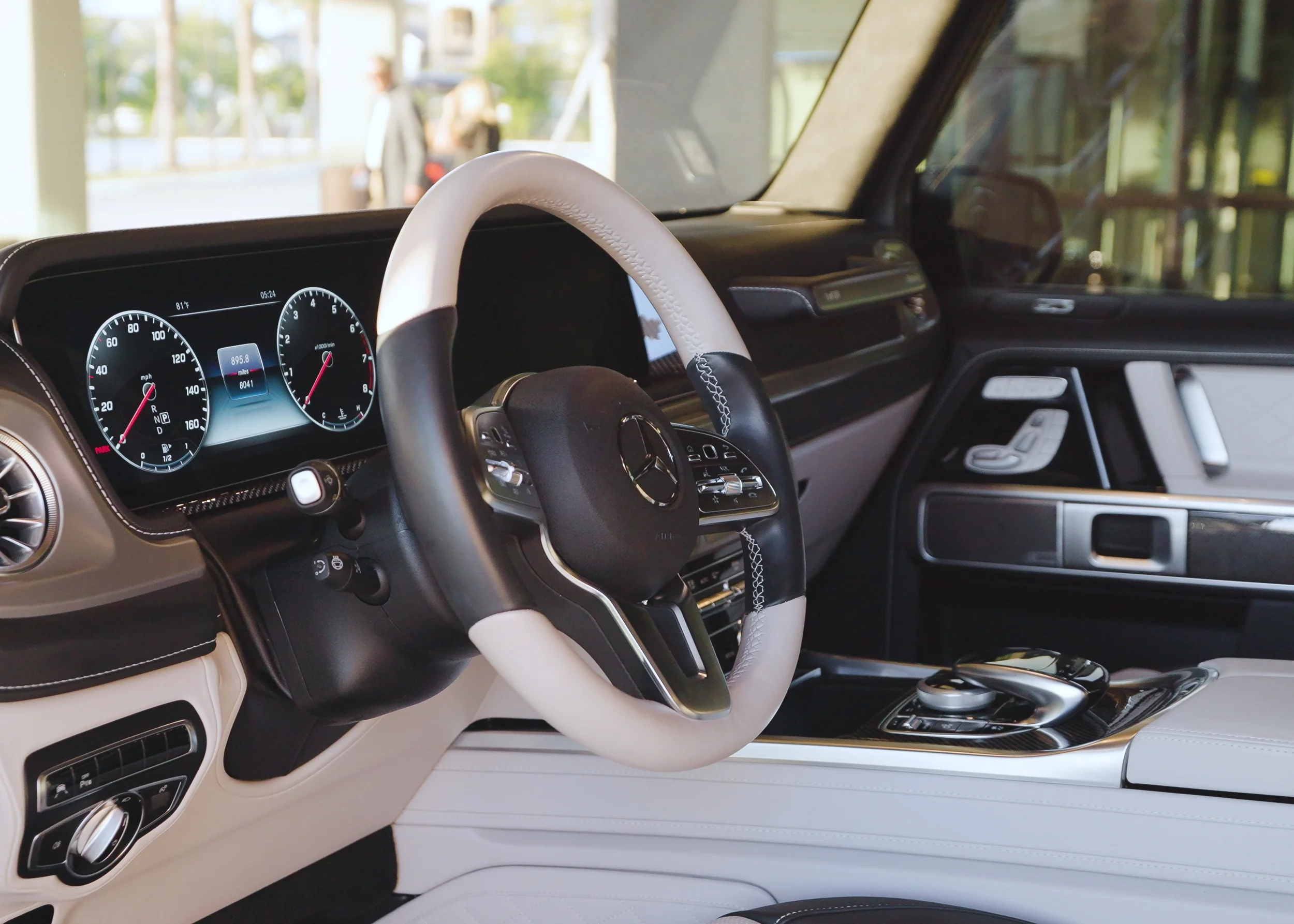 Sarasota Motor Club - luxury SUV rental Sarasota - Luxury SUV driving along Sarasota waterfront at sunset