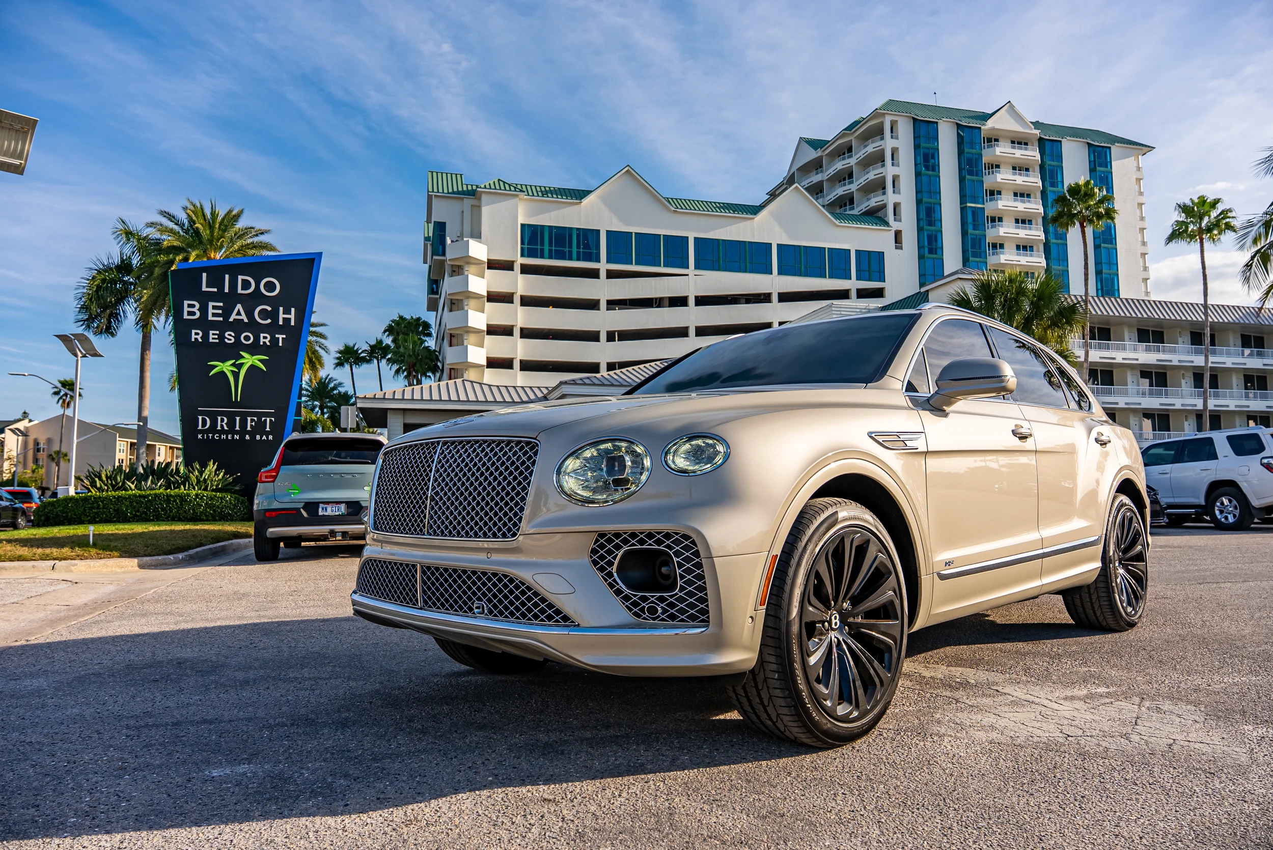 Sarasota Motor Club - Bentley rental Sarasota - Beige Bentley luxury SUV photographed in Sarasota promoting rental membership benefits