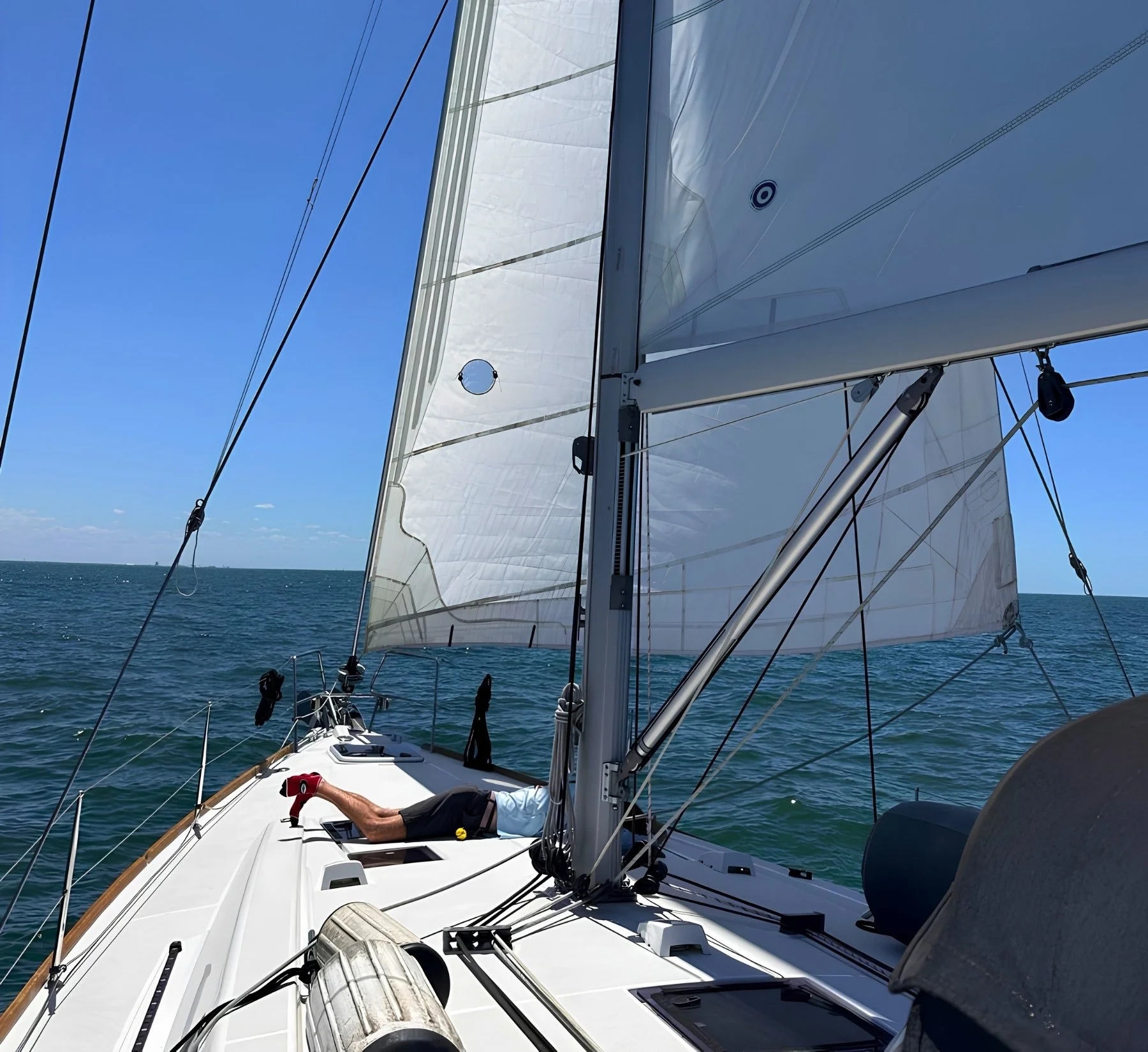 A guest steering the sailboat