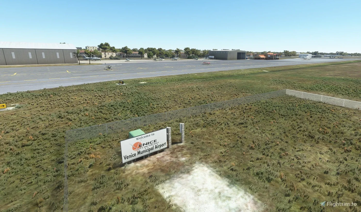 Sarasota Motor Club - Luxury Car SarasotA model of Venice Municipal Airport with a sign that reads 'Welcome to Venice City of the Gulf, Venice Municipal Airport'. Model-style grass and runway with small planes and airport buildings in the background.