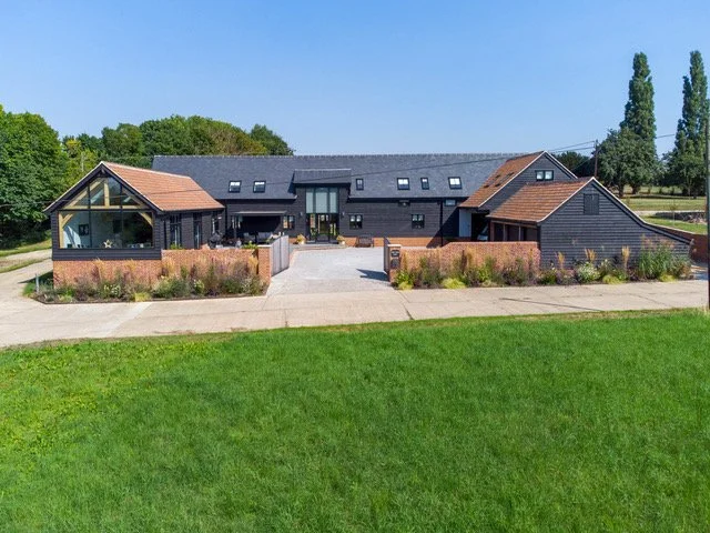 conversion & re-modelling of an existing grade II listed barn exterior