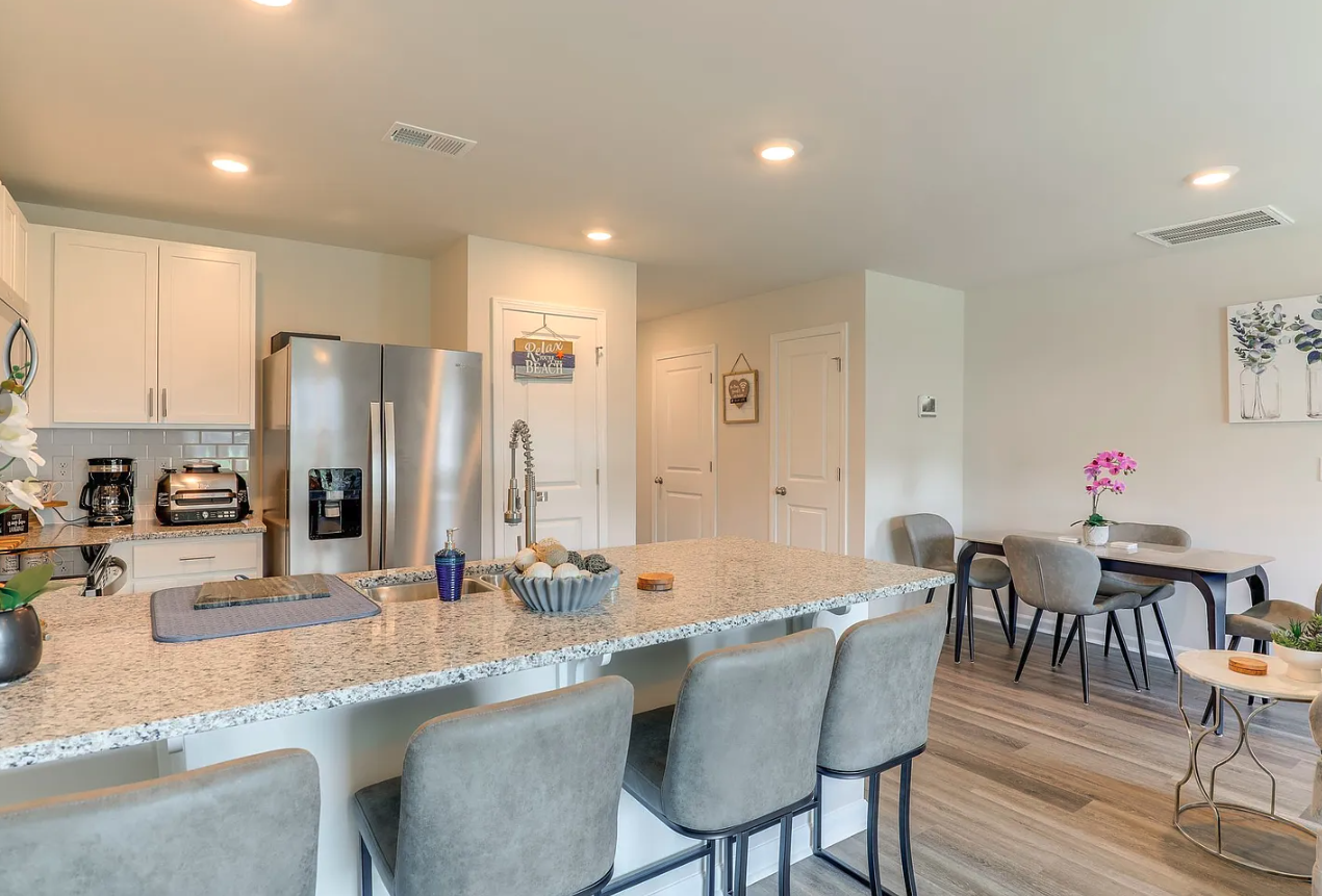A fully equipped kitchen wtih Granite Countertops, perfect for enjoying a night in.