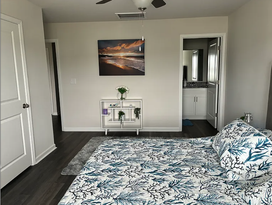 Sleep well in the spacious master suite featuring a plush king-sized bed and a private en-suite bathroom for the ultimate privacy and comfort. 