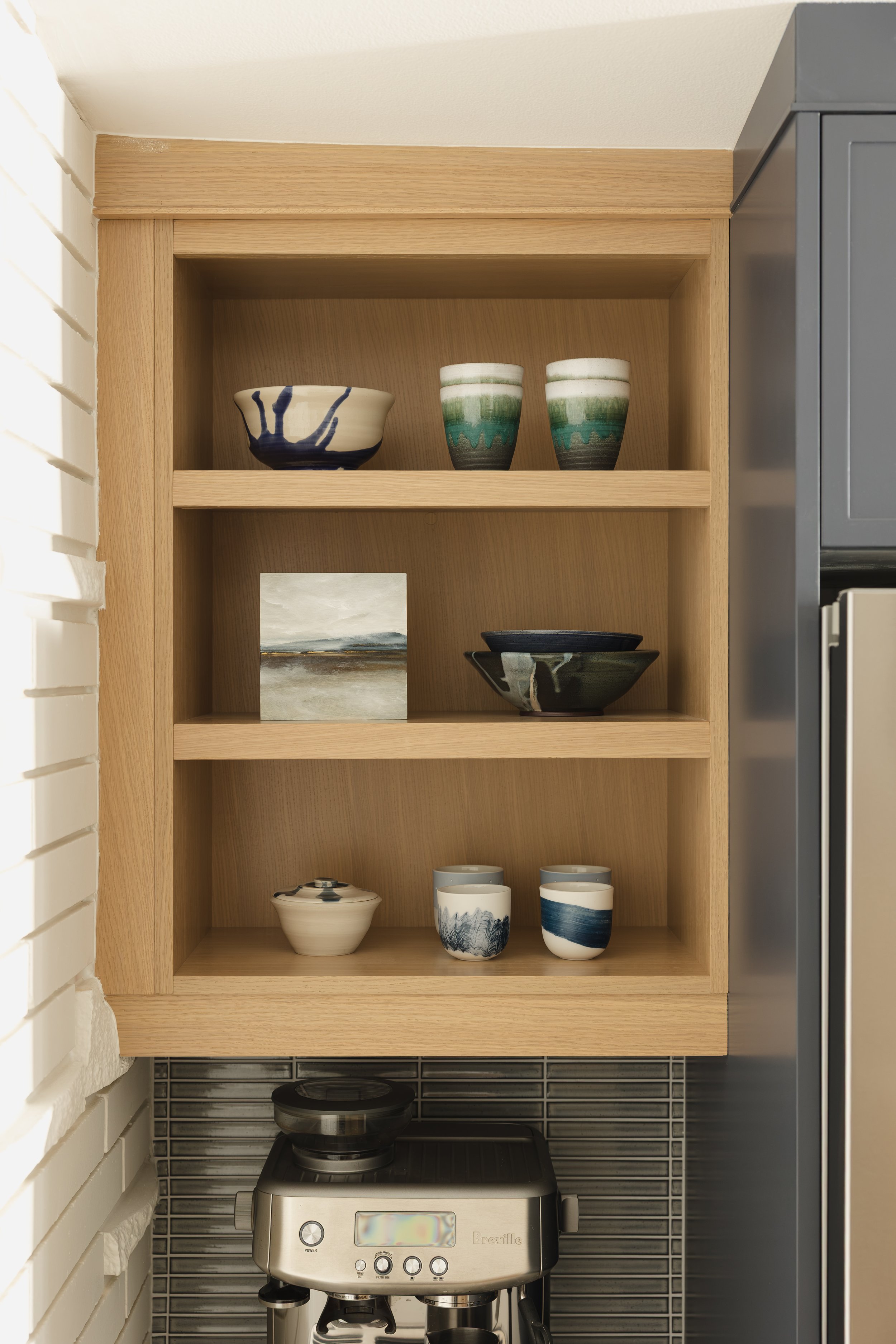 Ottawa interior design featuring a mid-century modern kitchen with open shelves.
