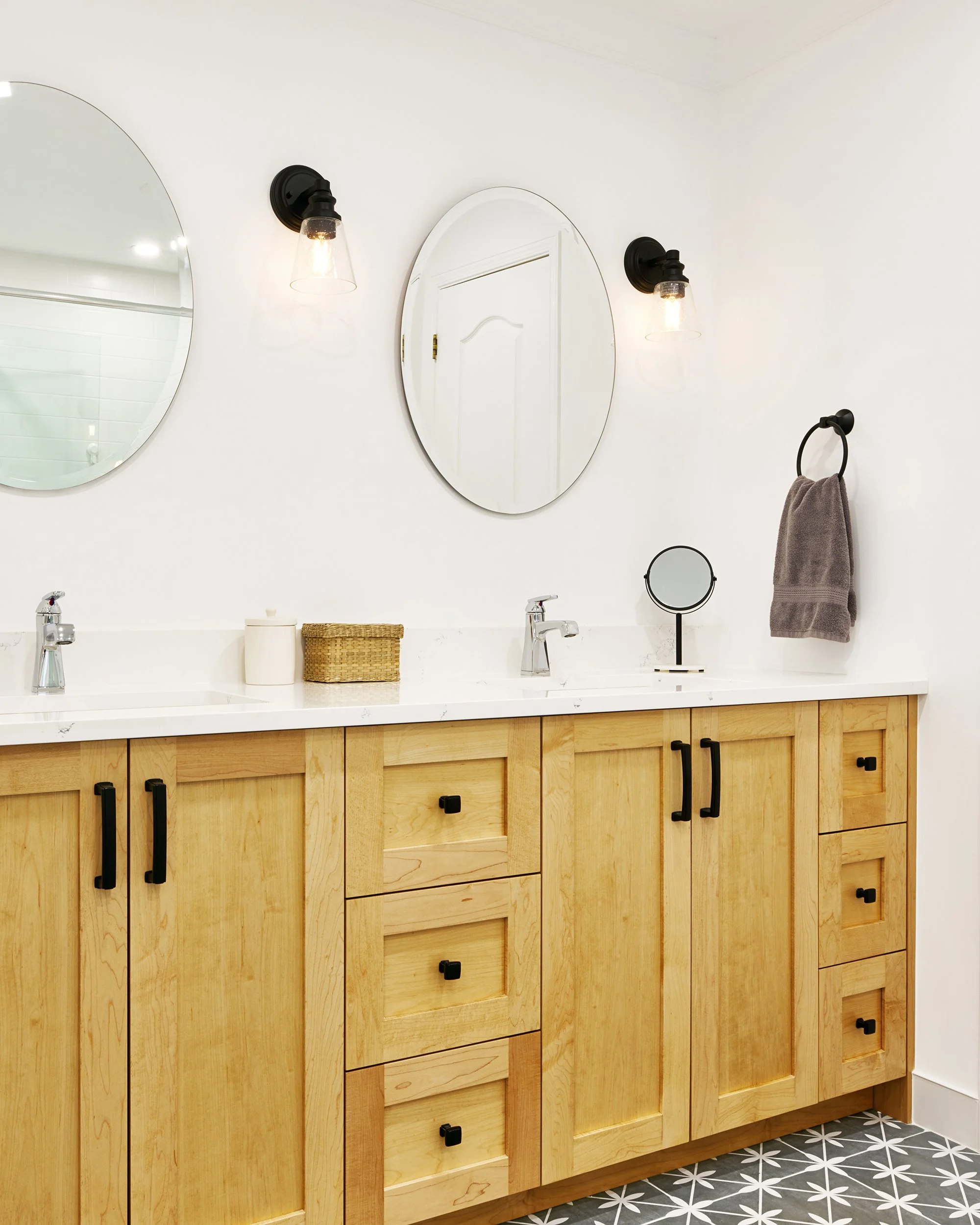 Ensuite bathroom design for an Ottawa family home featuring a custom natural maple vanity with lots of drawers. 