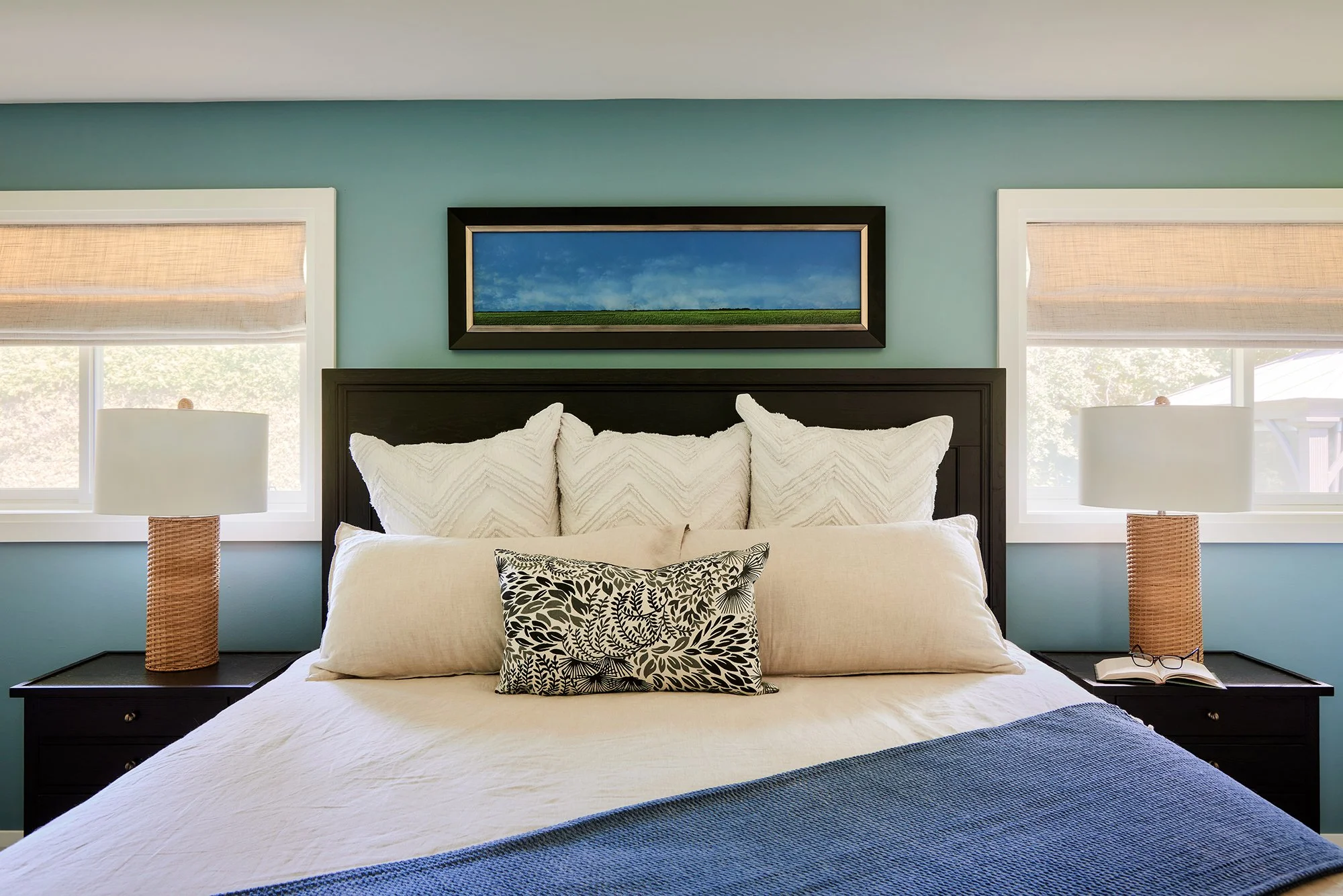 Principal bedroom design for an Ottawa family home featuring luxurious linen bedding. 