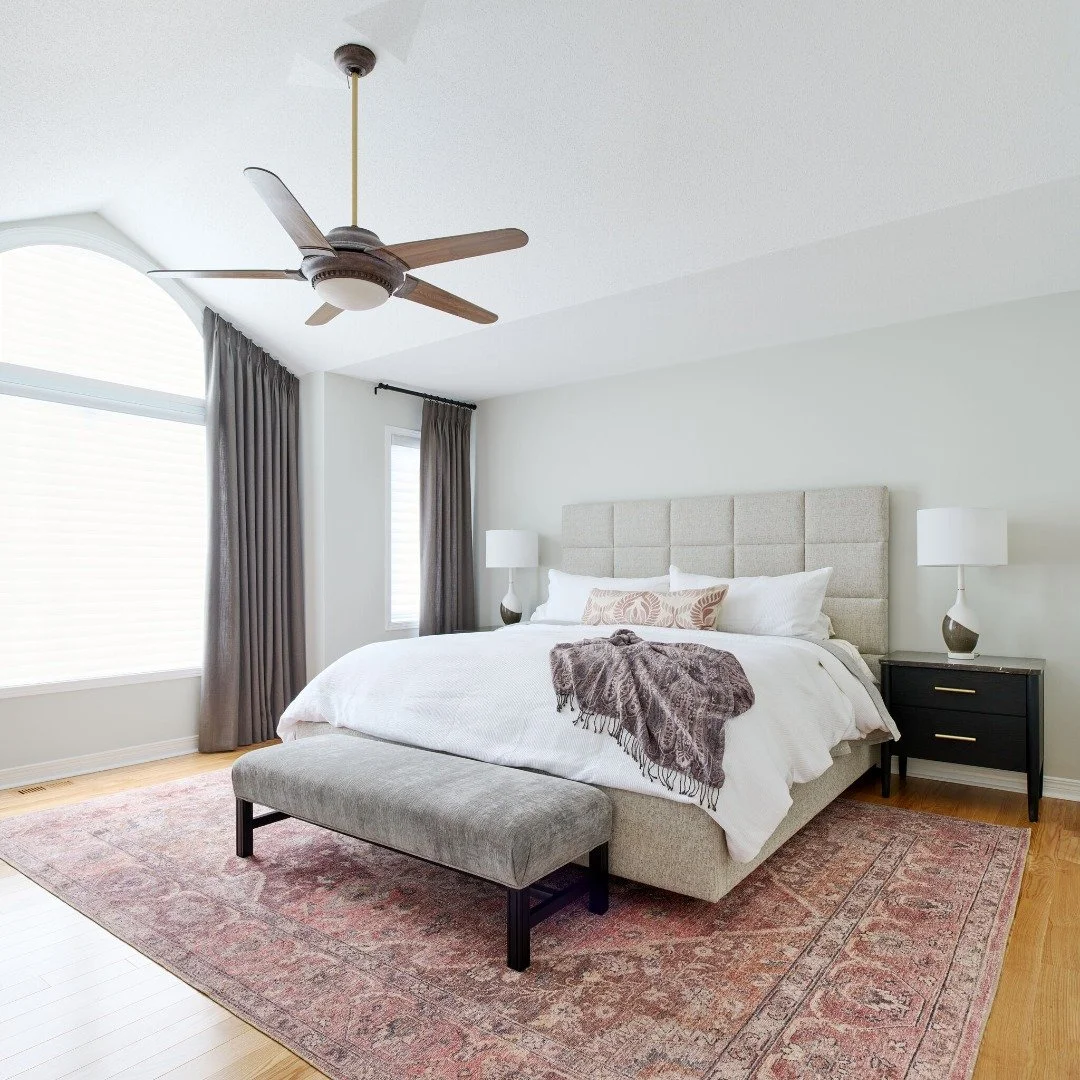Beautiful window treatments have a way of elevating a space instantly.

In this primary bedroom, we layered stationary side panels with functional blinds to create a designer look - without sacrificing the everyday comfort our clients needed. The res