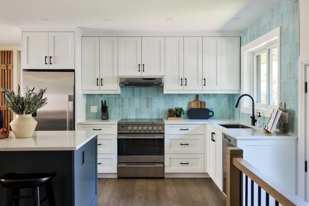 If you love colour, your home should reflect that. 

The colourful backsplash is this homeowners favourite part of their kitchen as it creates such an impact in this open concept space. All the furniture, lighting and artwork were chosen with care to