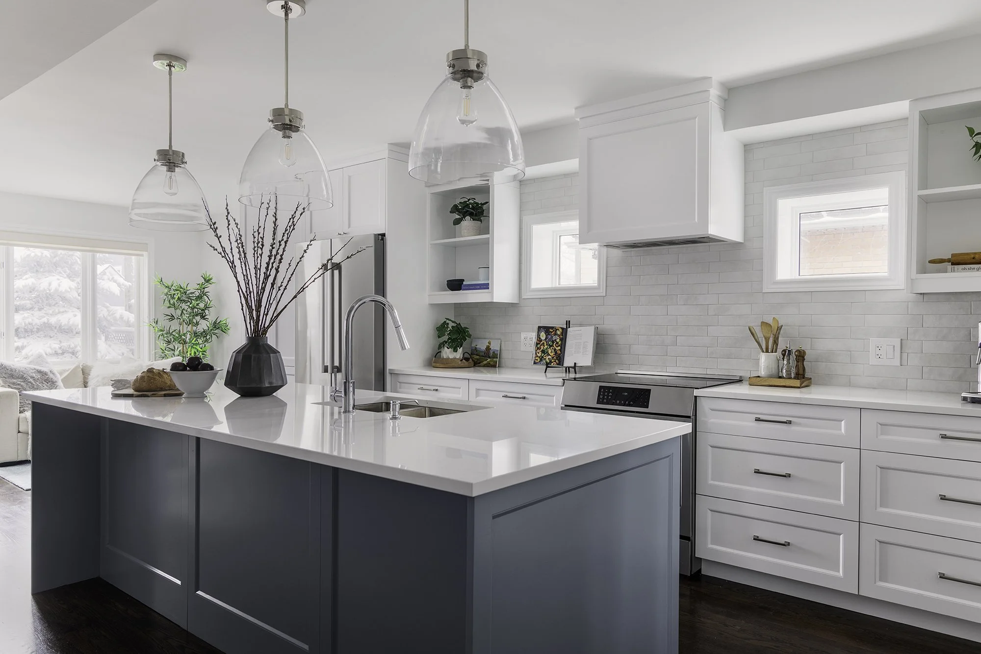 Ottawa kitchen renovation featuring a blue island and open shelves.