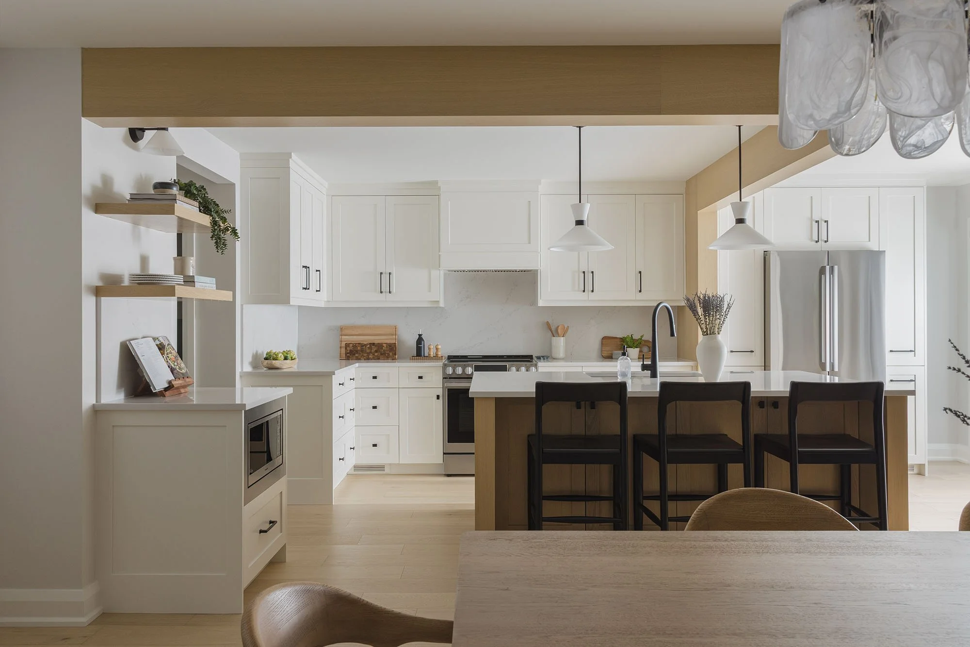 Kitchen renovation in Ottawa featuring white oak flooring and white oak clad bulkheads. 